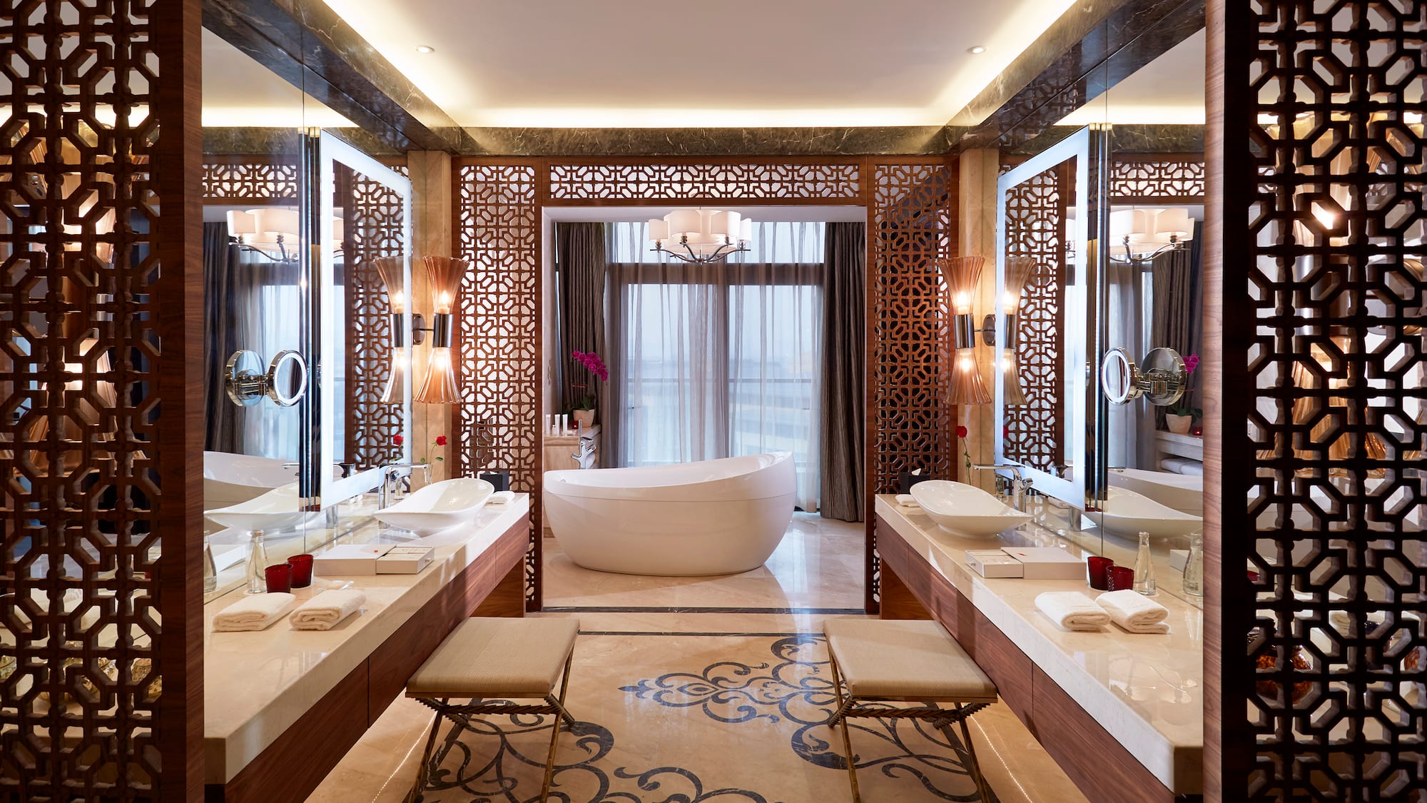 a bathroom with a tub and sinks