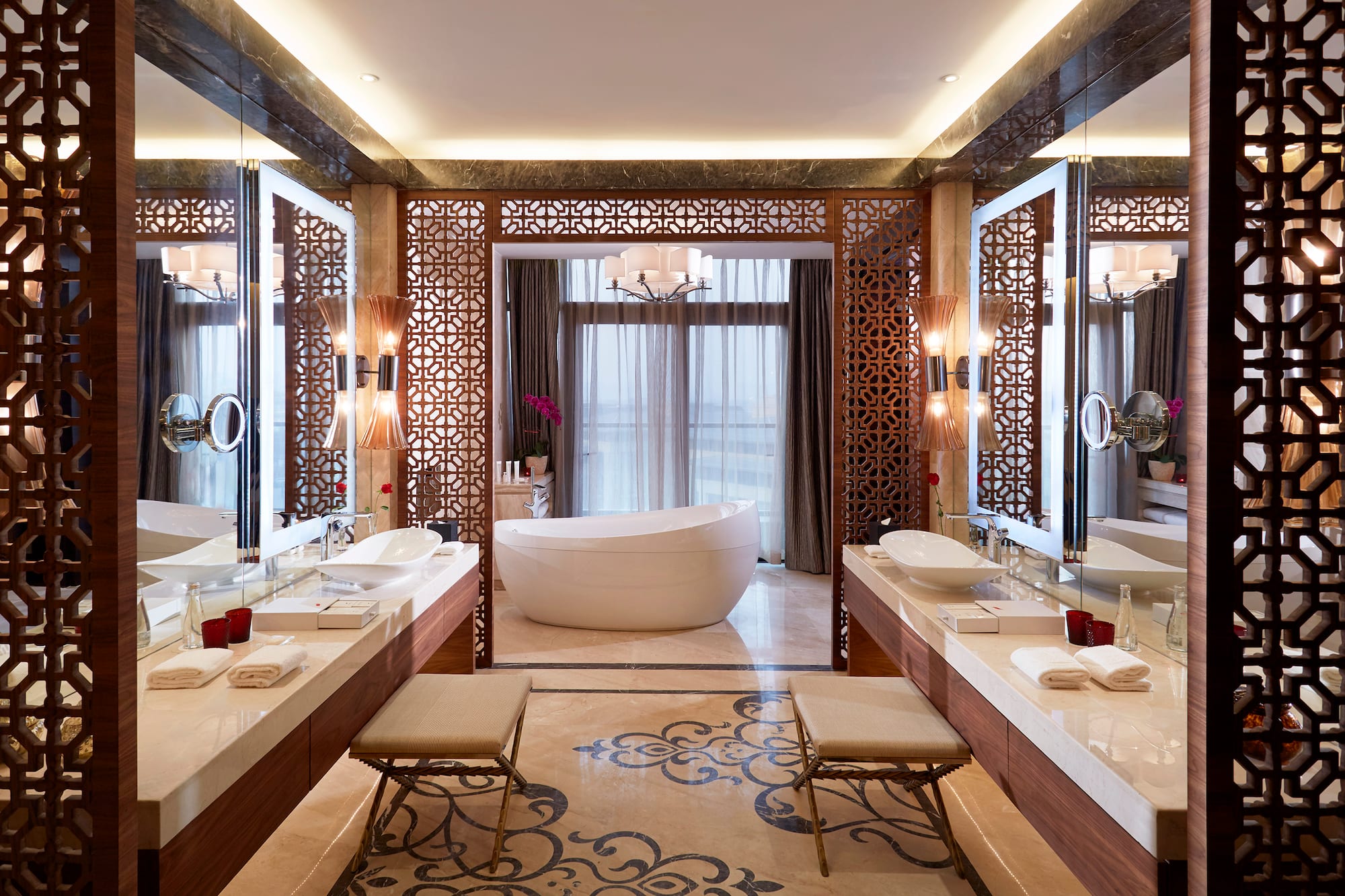 a bathroom with a tub and sinks