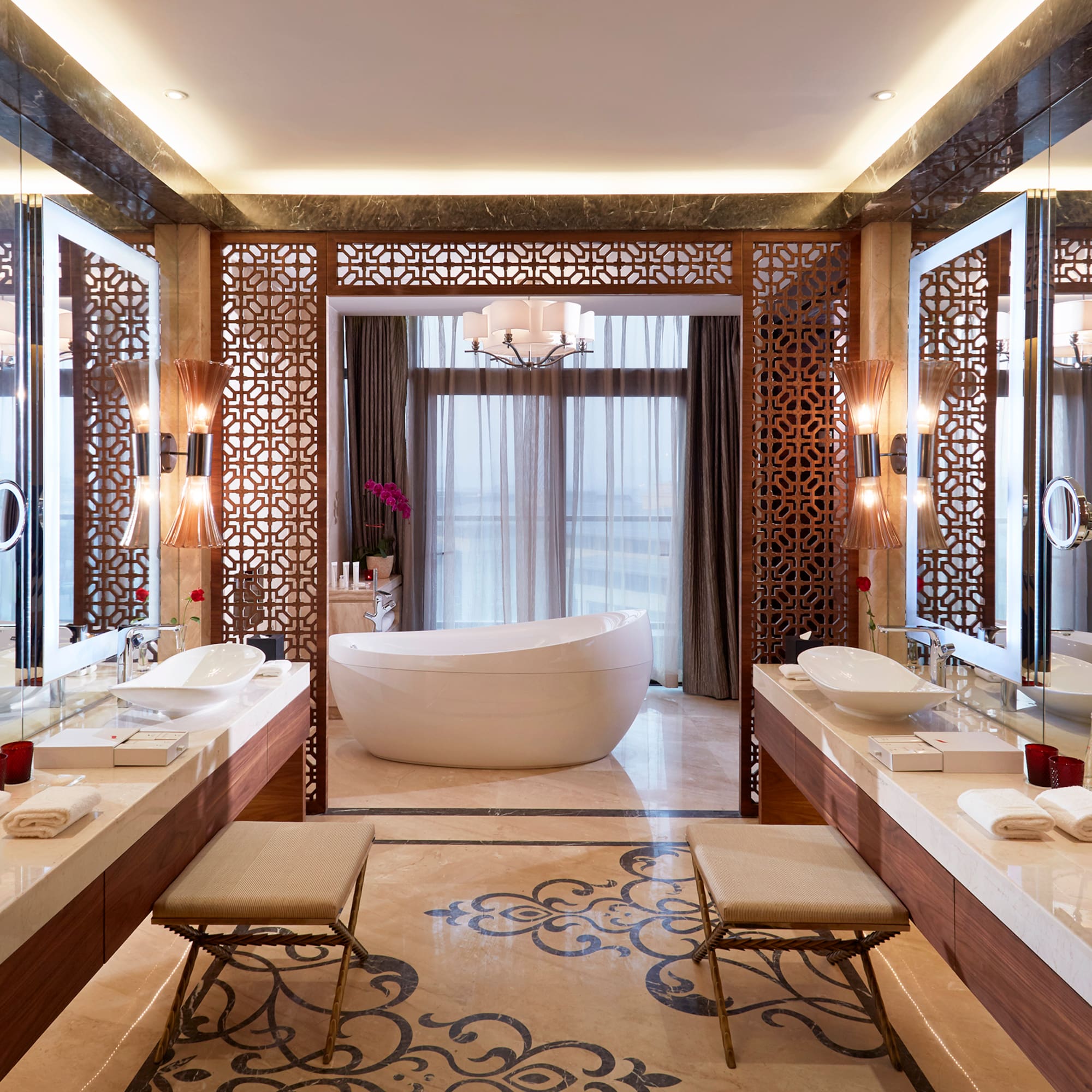 a bathroom with a tub and sinks