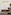 Elegant The Level reception with blurred staff, modern wood and gold cabinet.