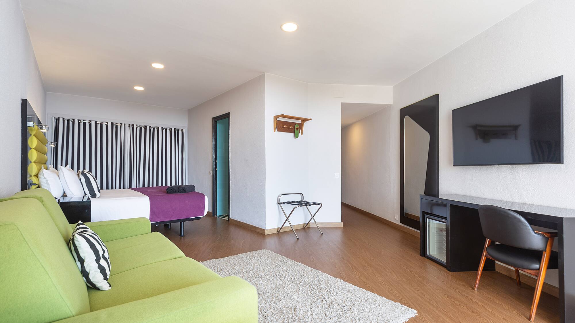 a room with a television and a bed