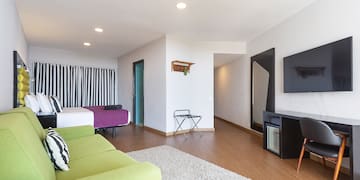 a room with a television and a bed