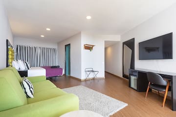 a room with a television and a bed