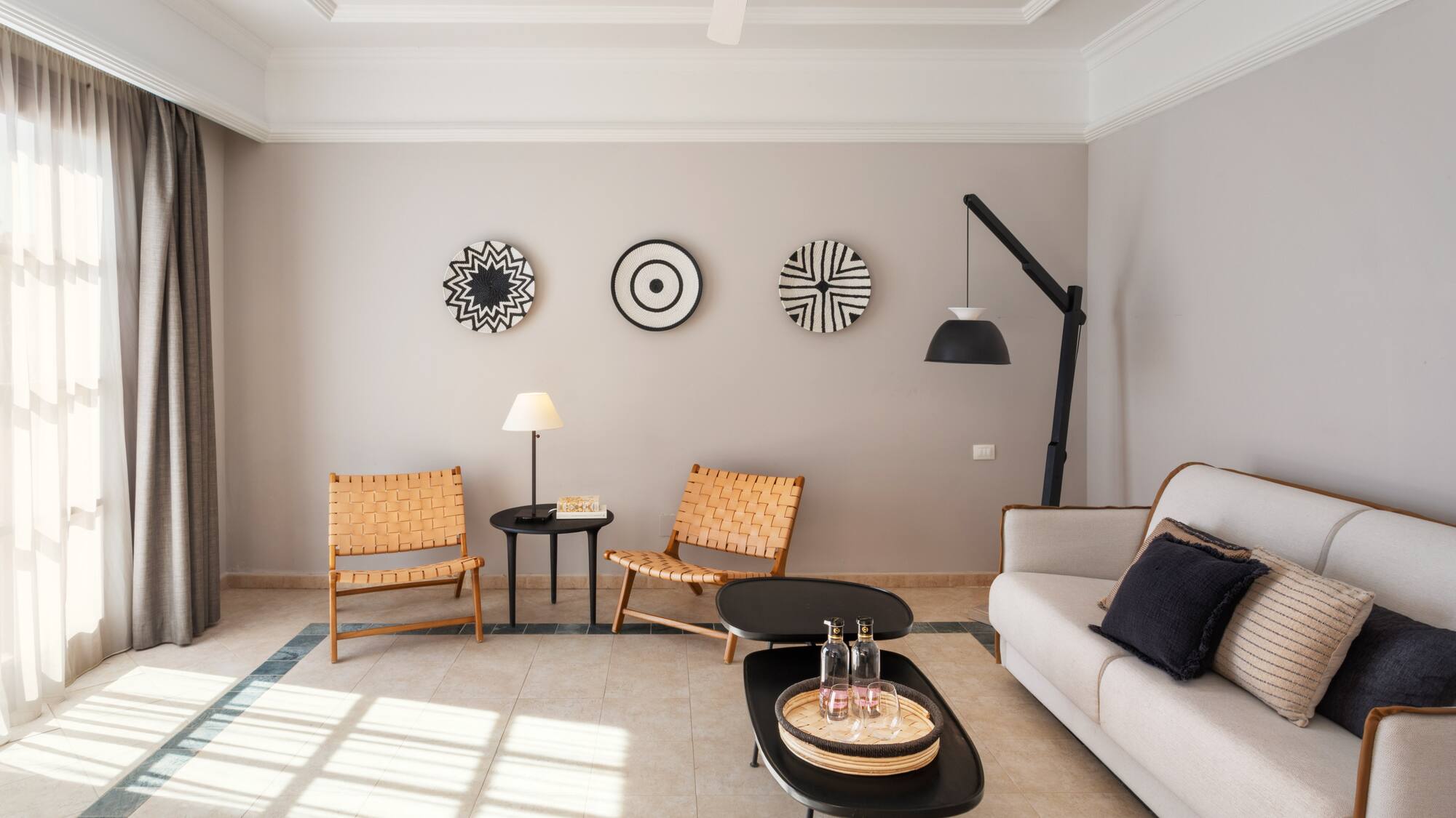 a living room with a couch and chairs