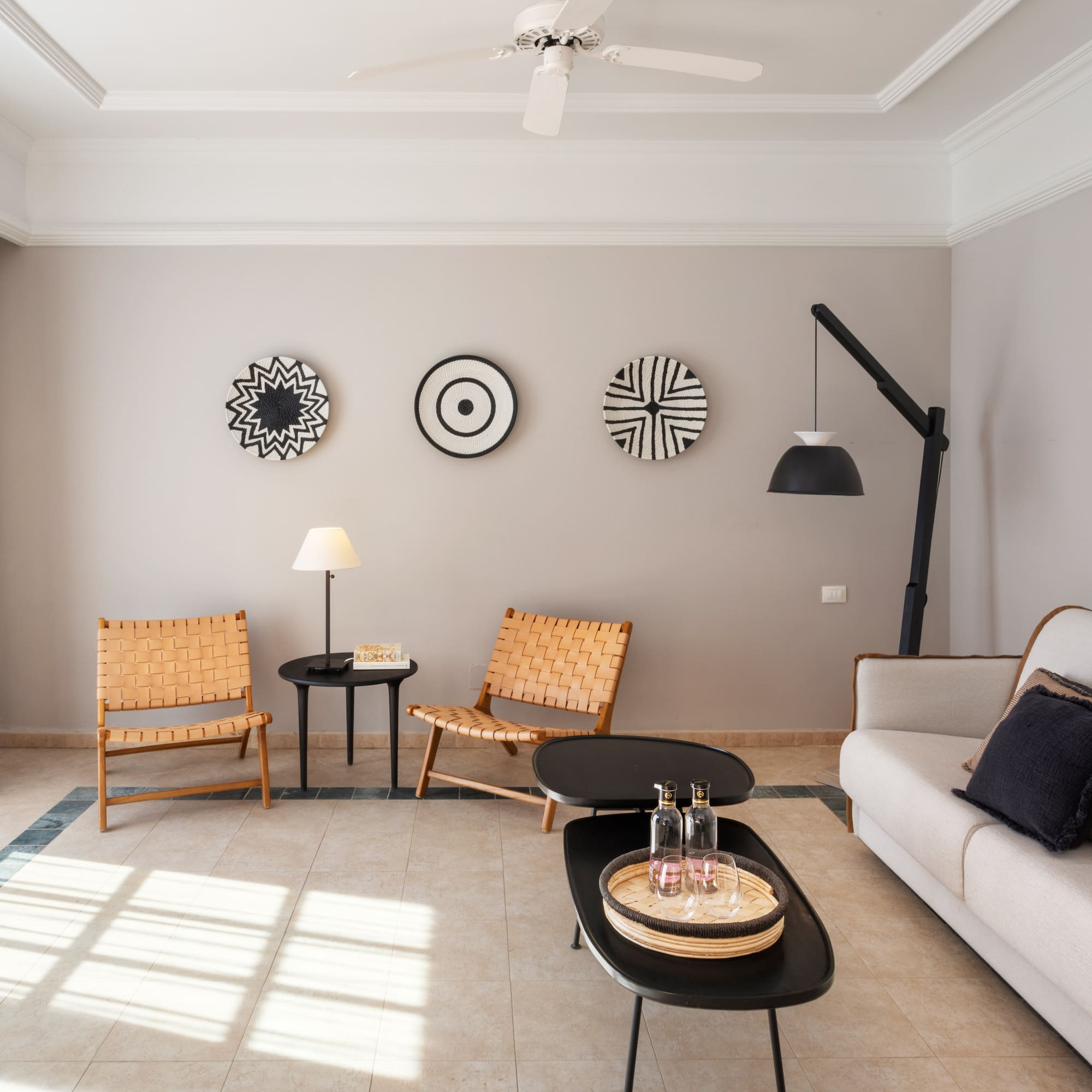 a living room with a couch and chairs