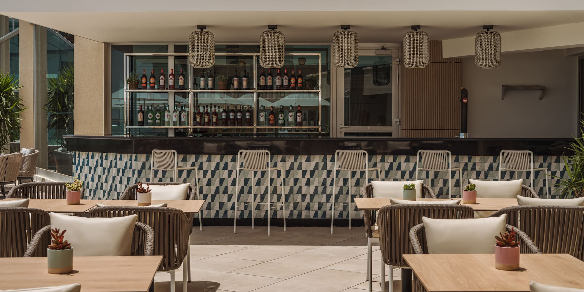 a patio with tables and chairs