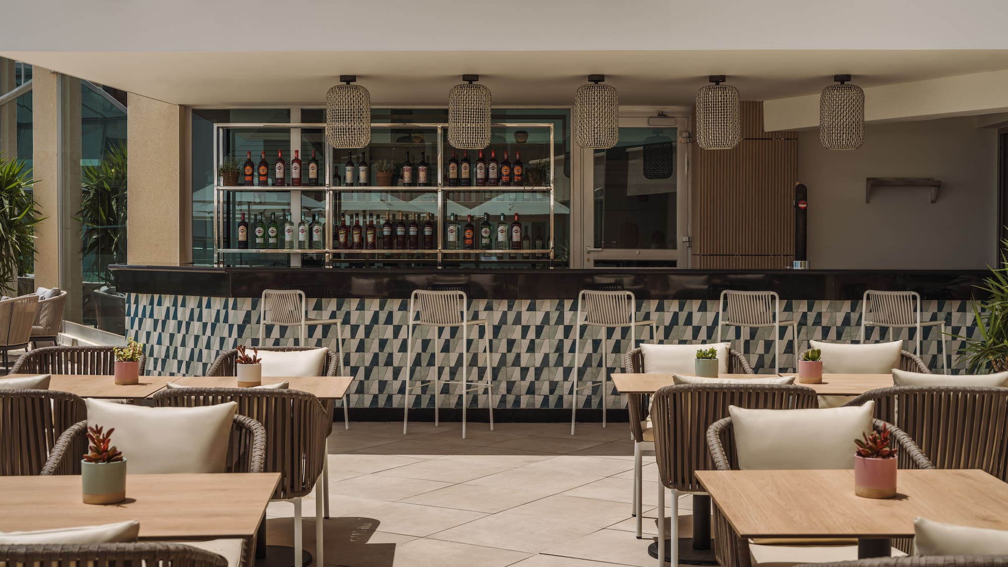 a patio with tables and chairs