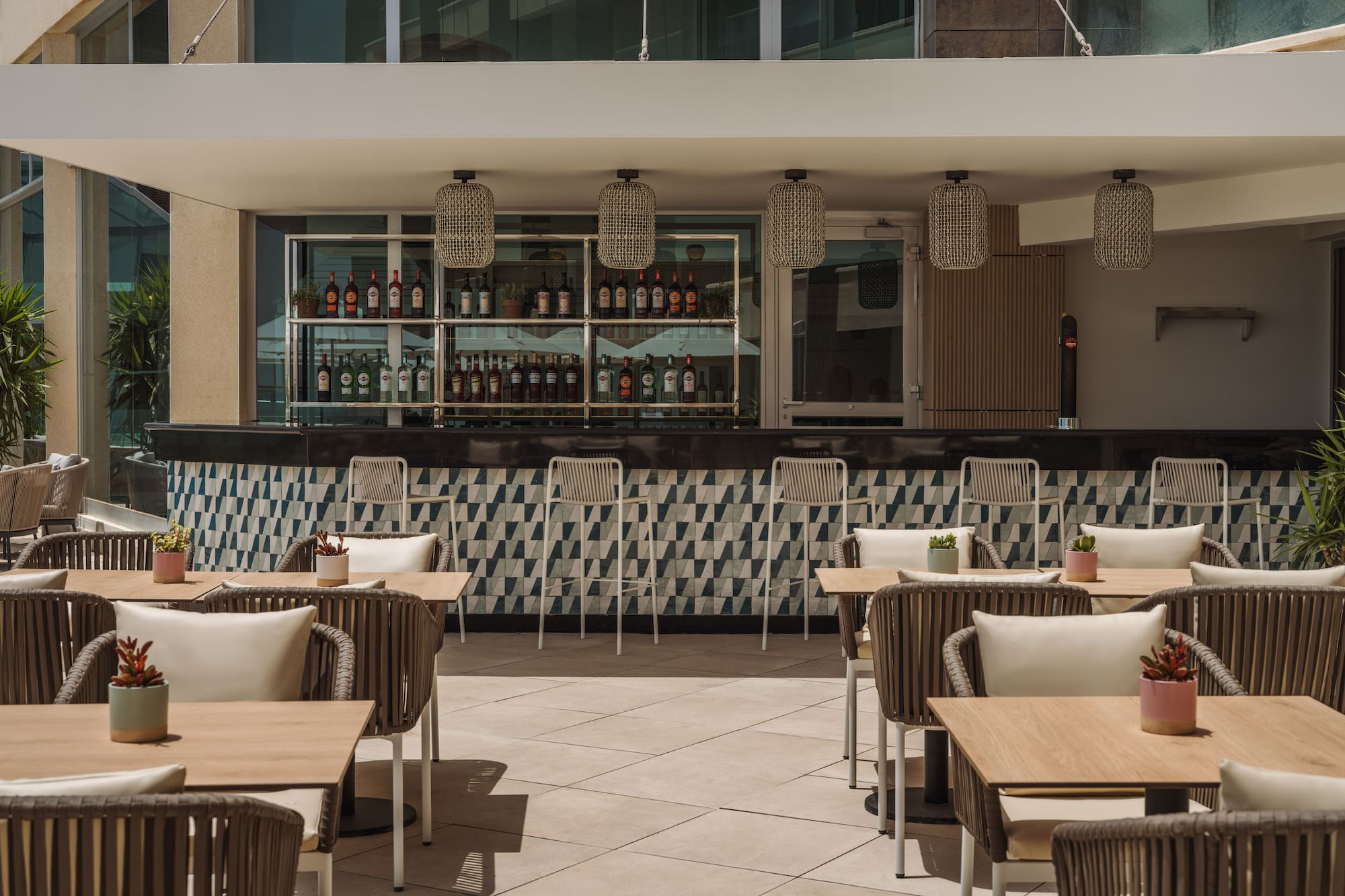 a patio with tables and chairs