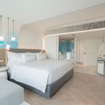 a room with a bed and a mirror