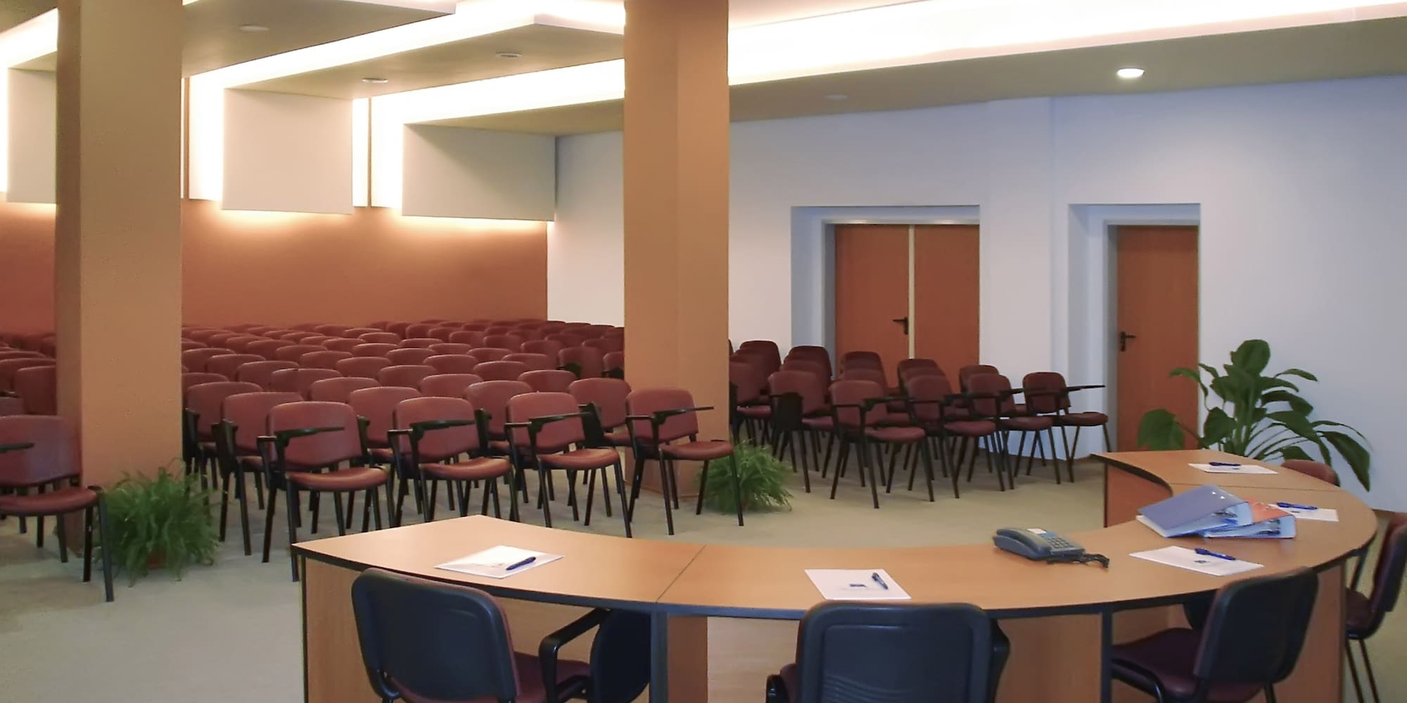 a room with a round table and chairs
