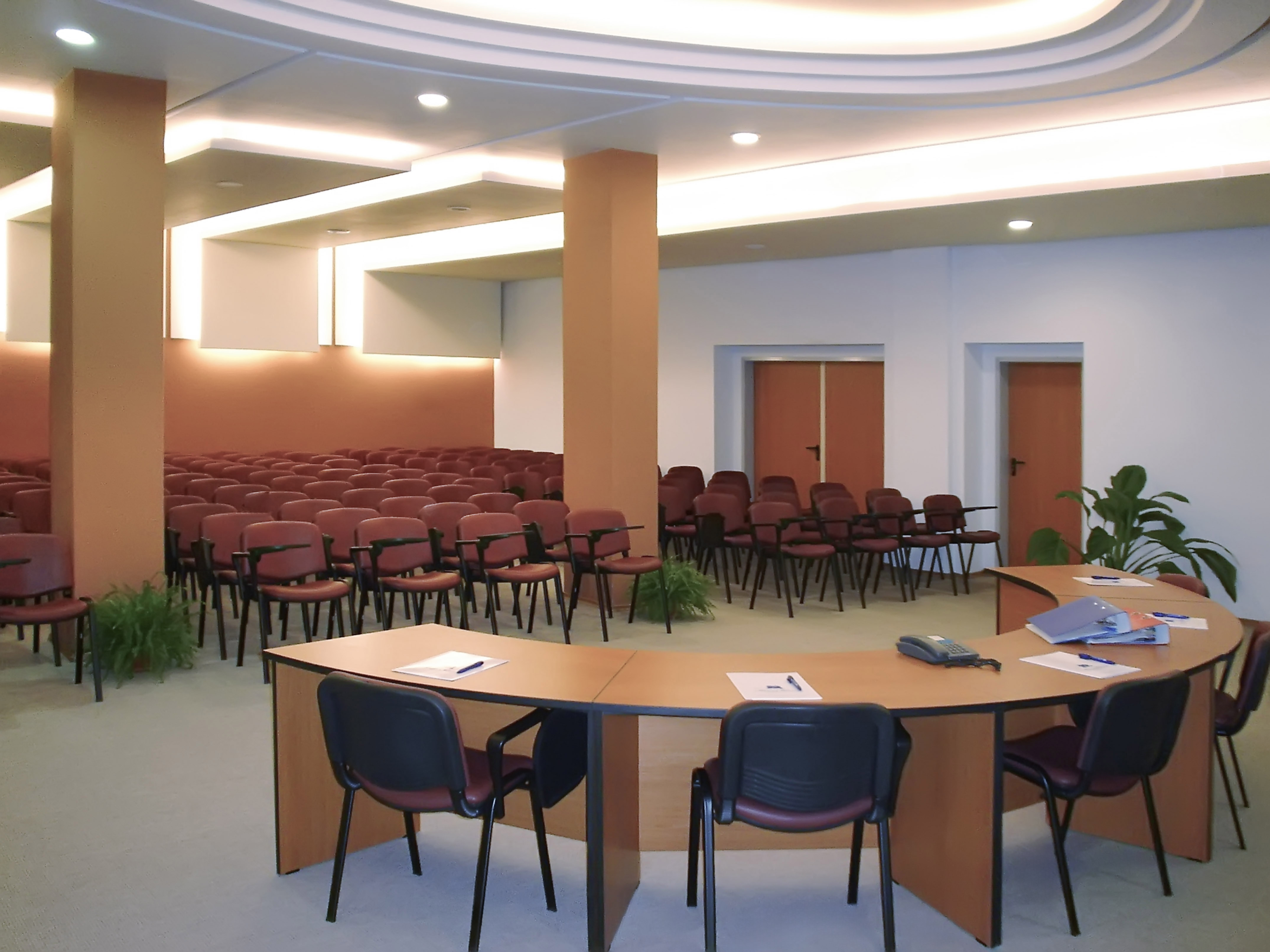 a room with a round table and chairs