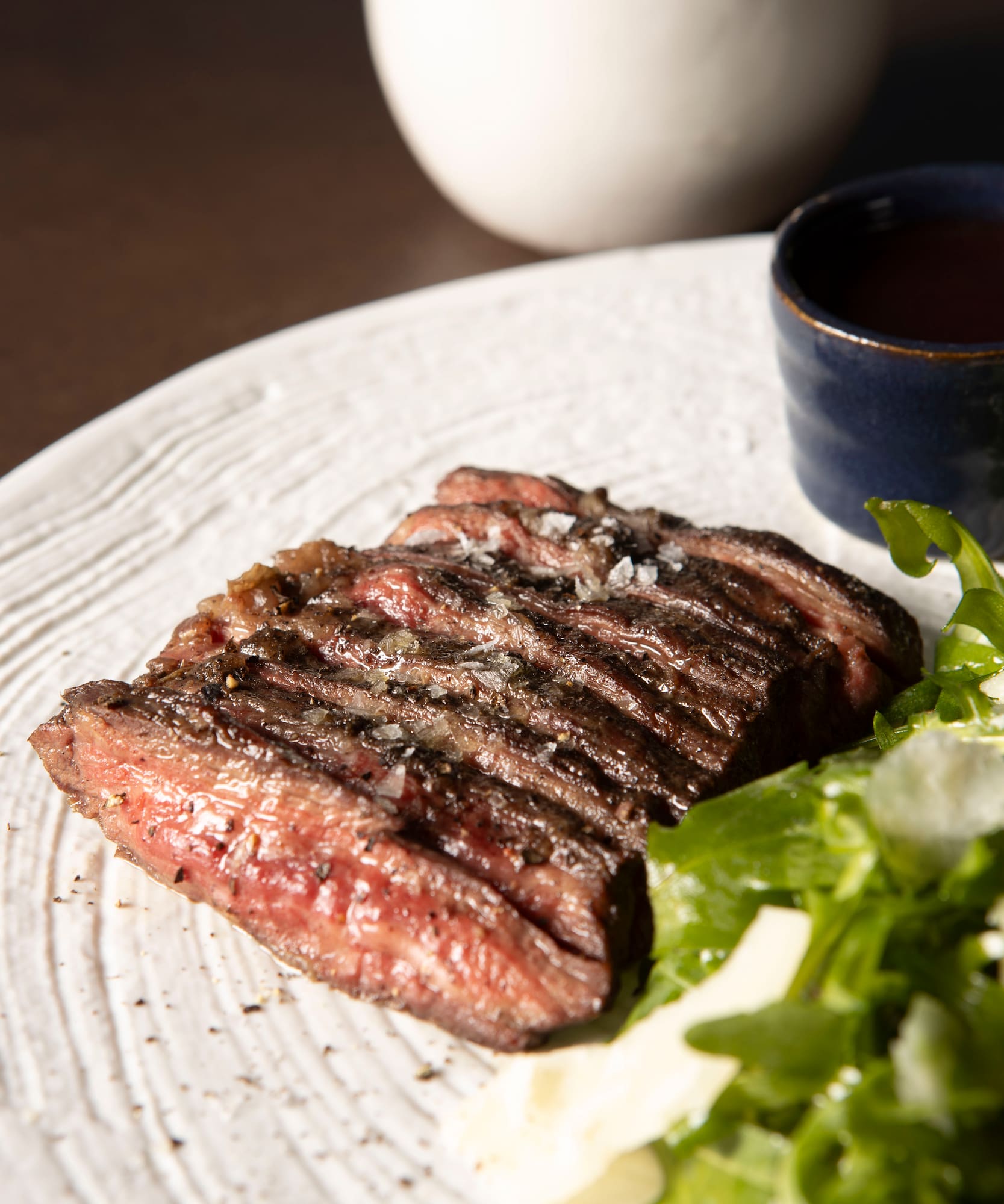 a plate of steak and salad