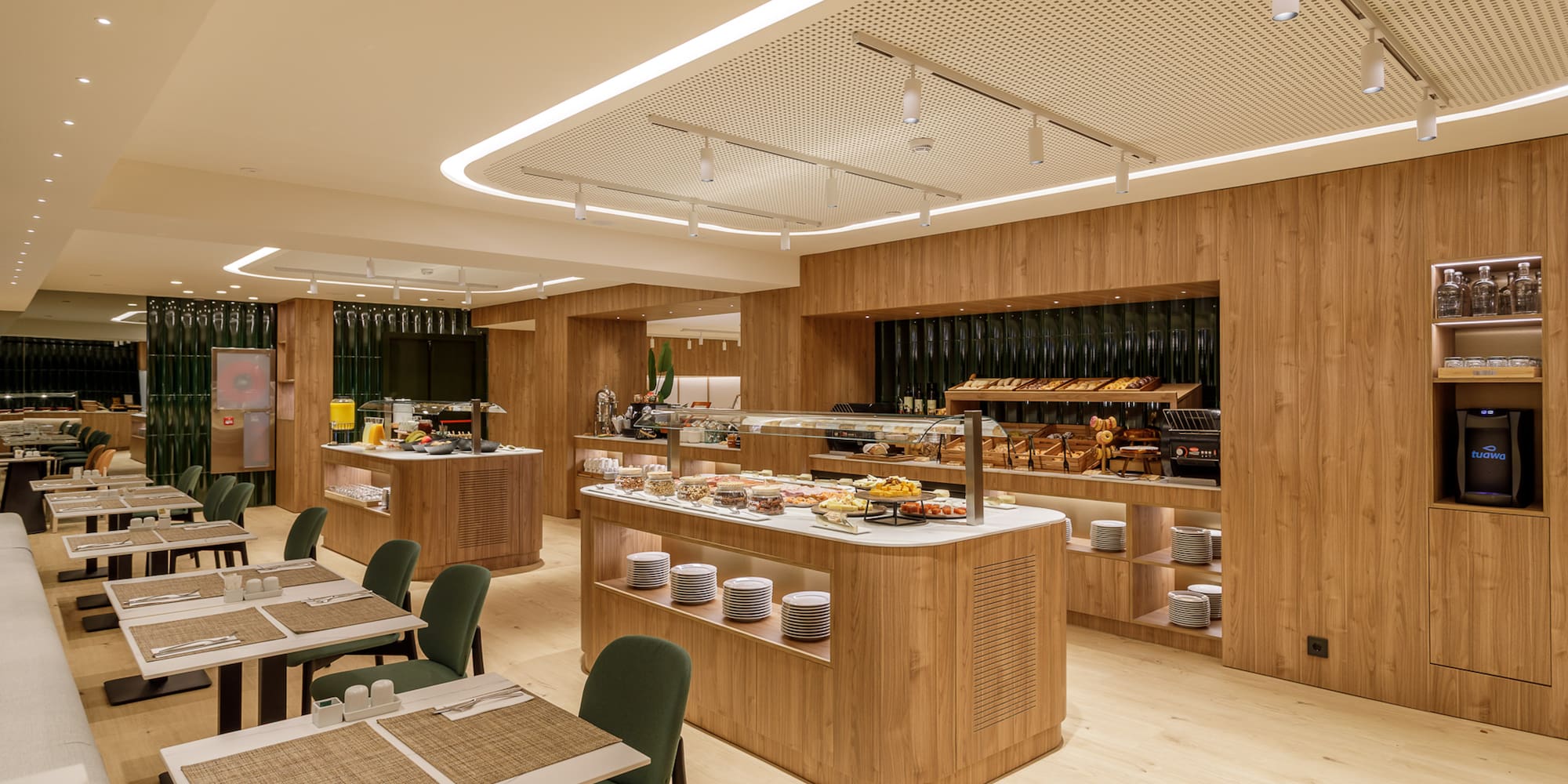 Modern hotel breakfast buffet and dining area with wooden finishes.
