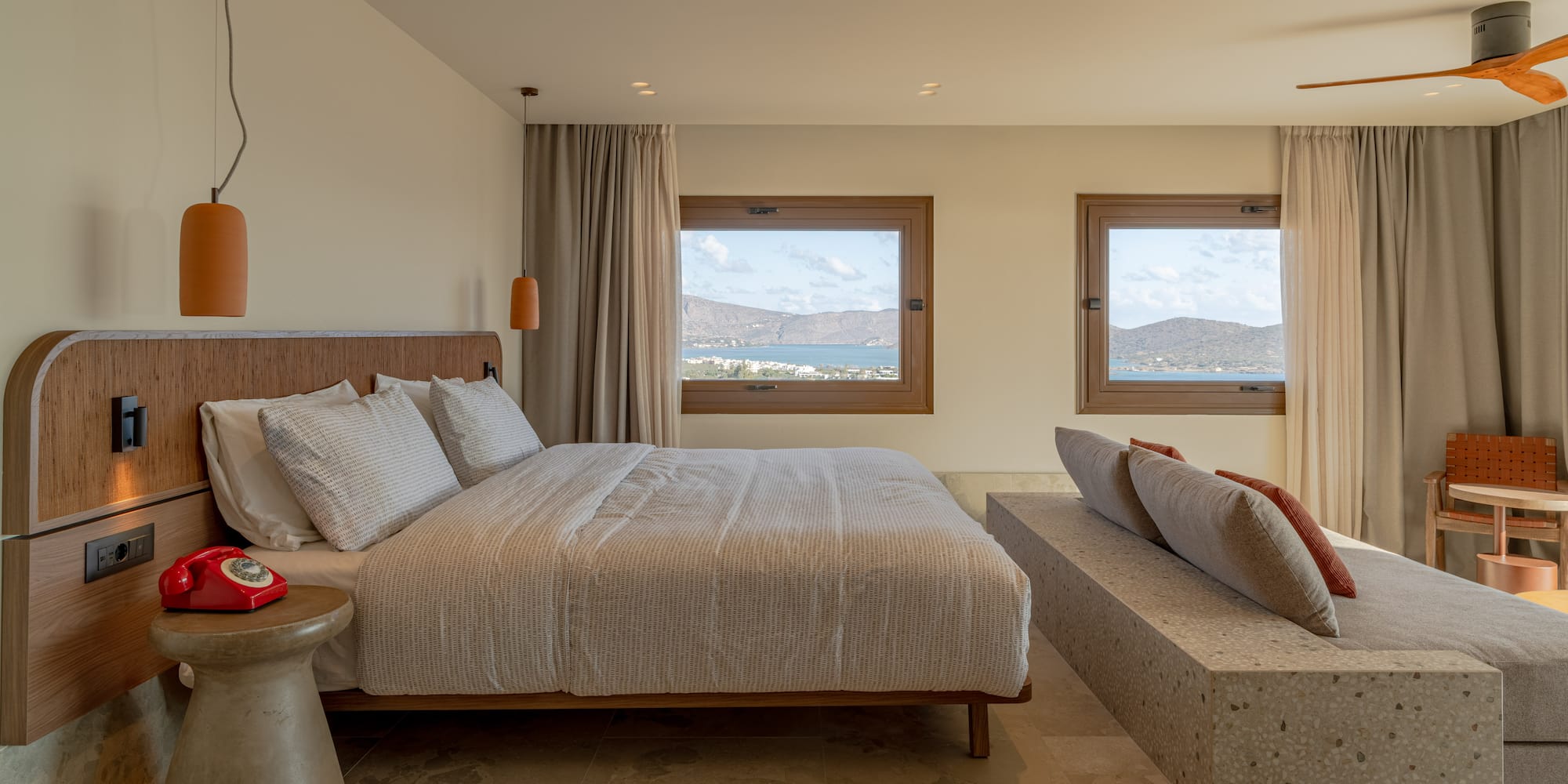 a bedroom with a bed and a bench