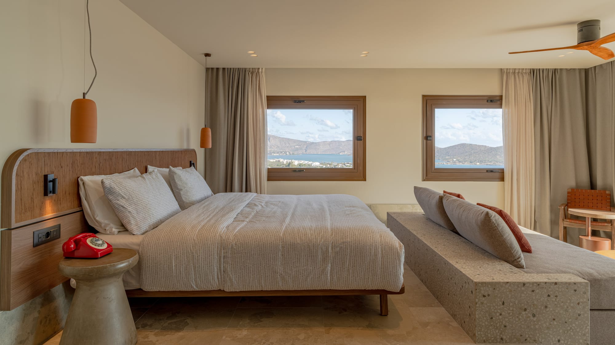 a bedroom with a bed and a bench