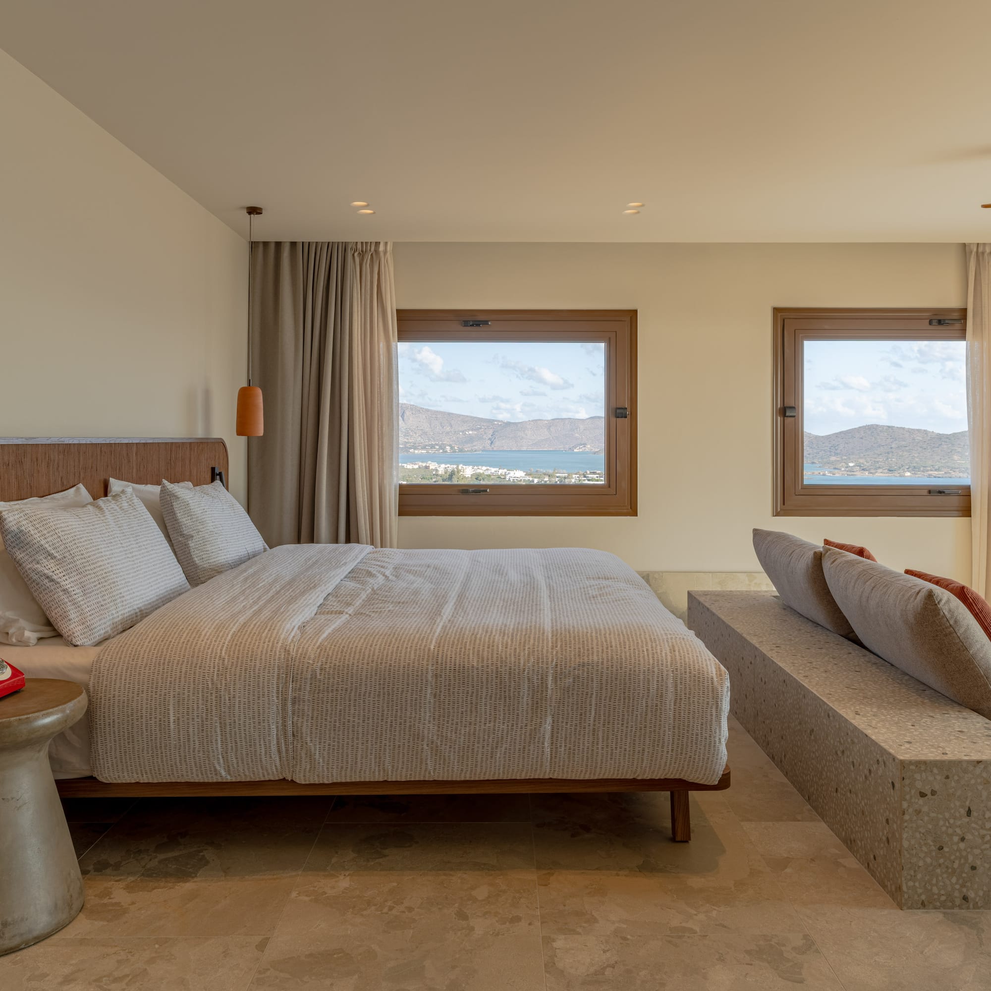 a bedroom with a bed and a bench