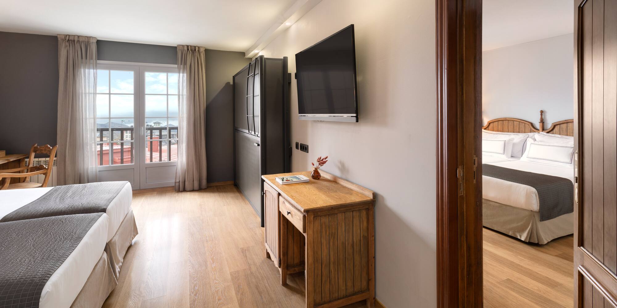 a room with a tv and a bed