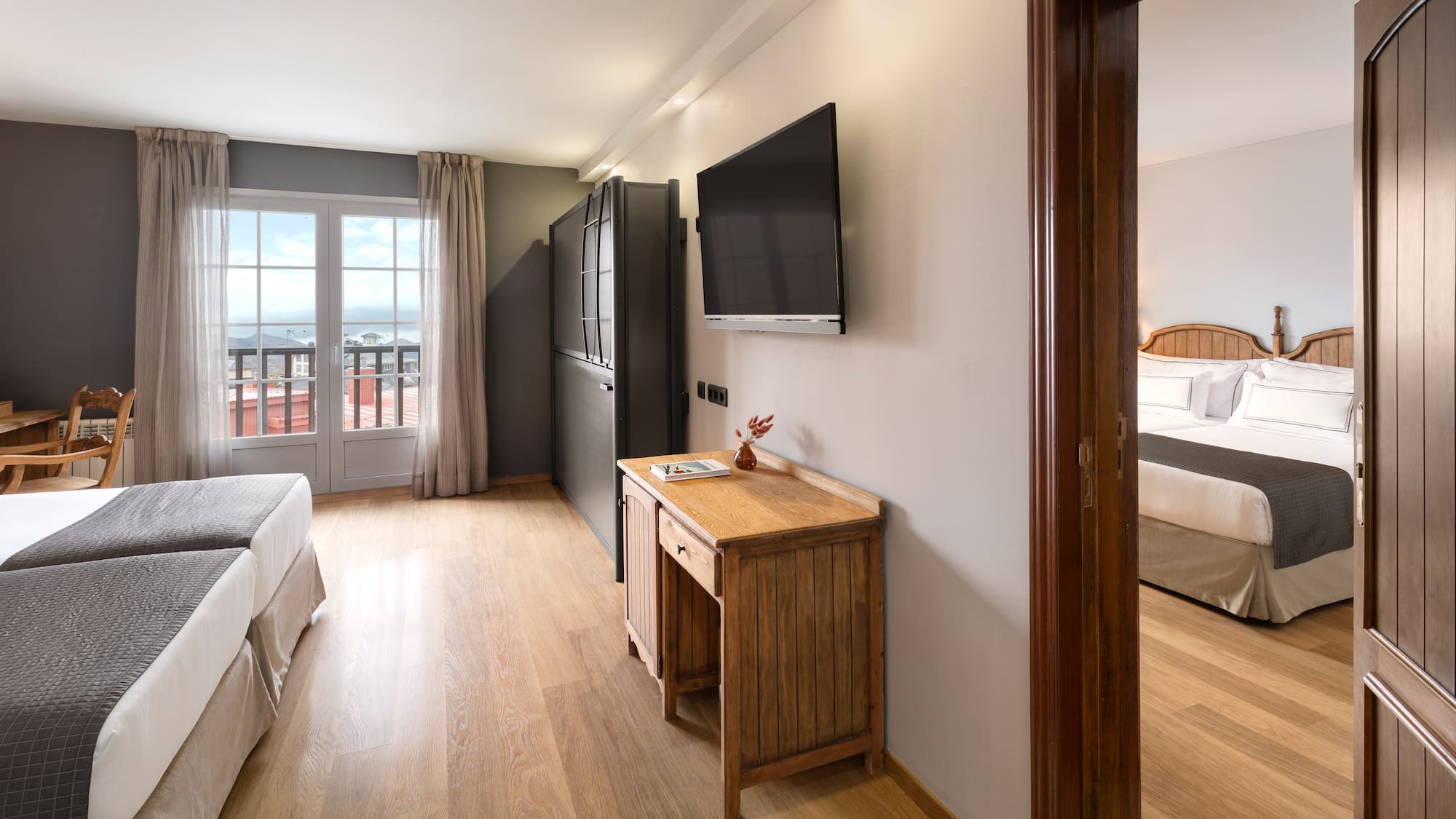 a room with a tv and a bed