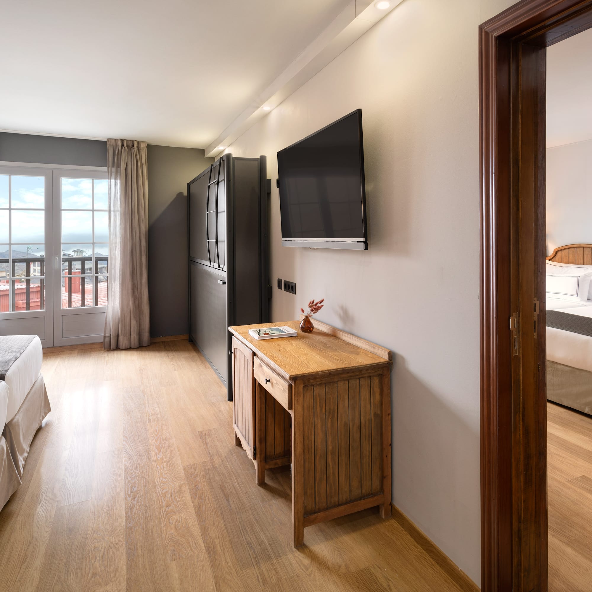 a room with a tv and a bed