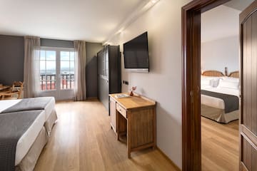 a room with a tv and a bed