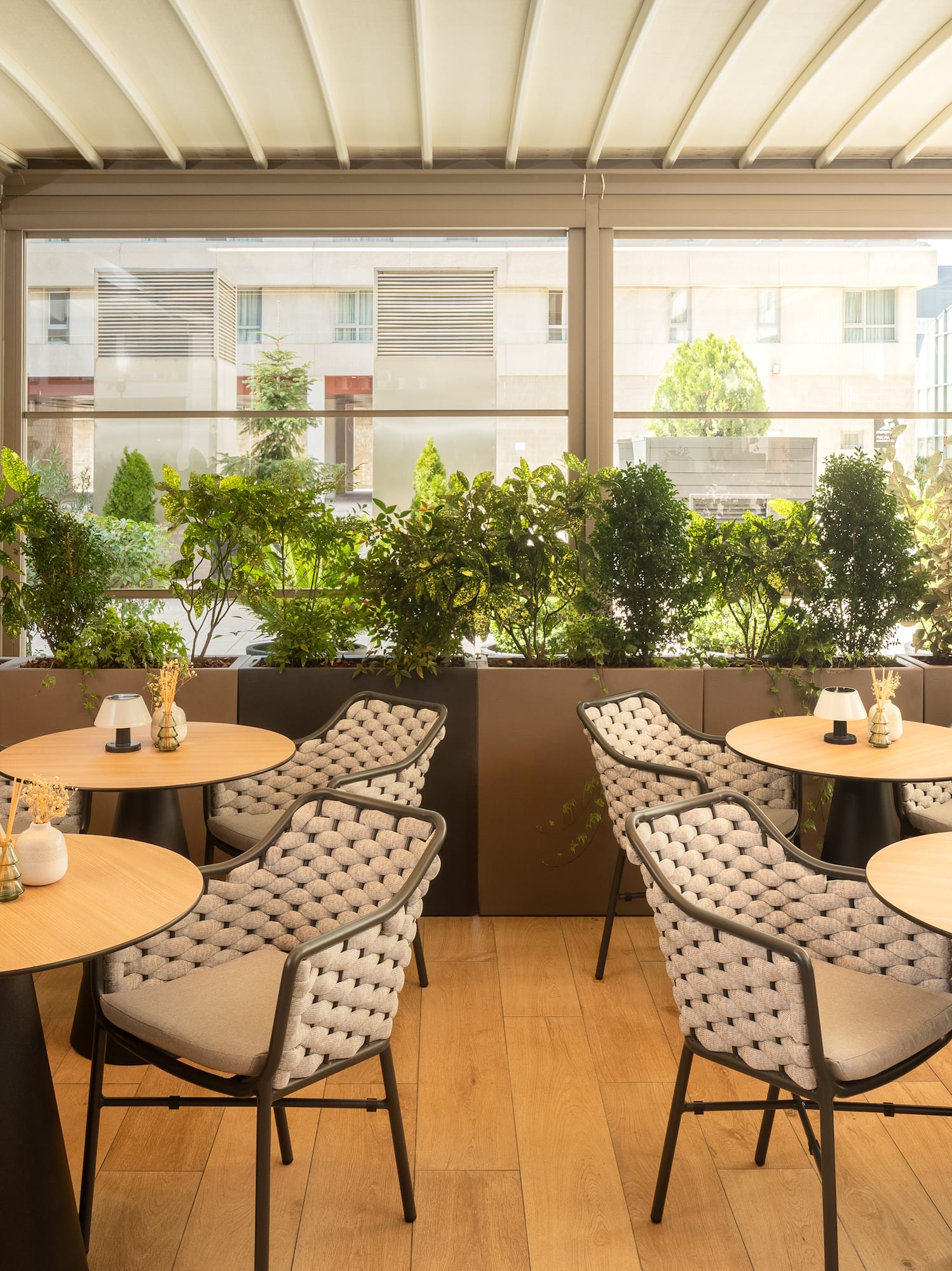 a table and chairs in a room with a window