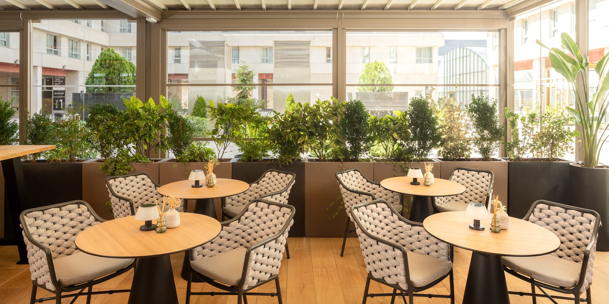 a table and chairs in a room with a window