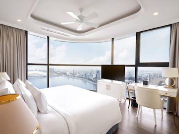 a room with a large window overlooking a city