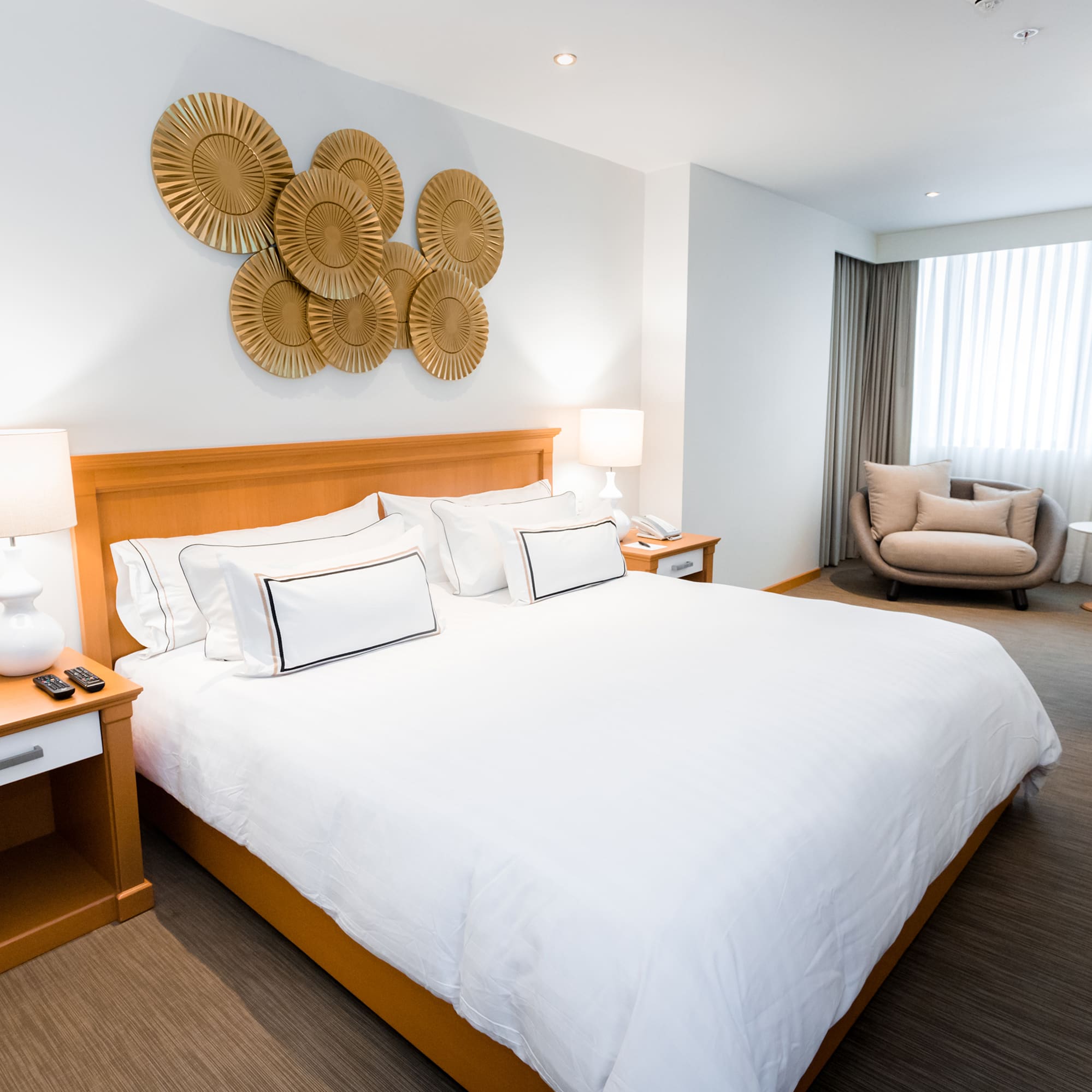 a bedroom with a bed and a chair