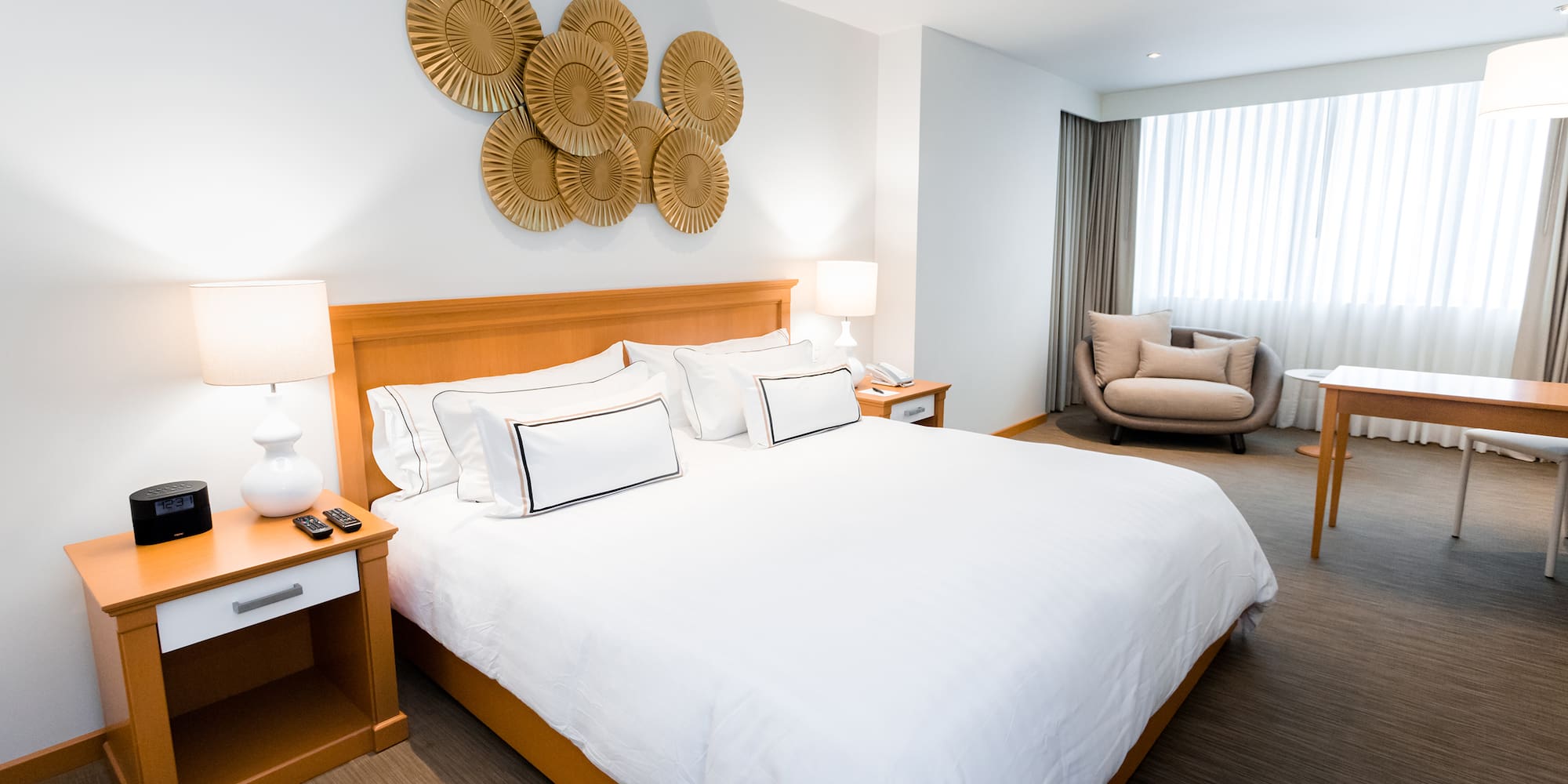 a bedroom with a bed and a chair