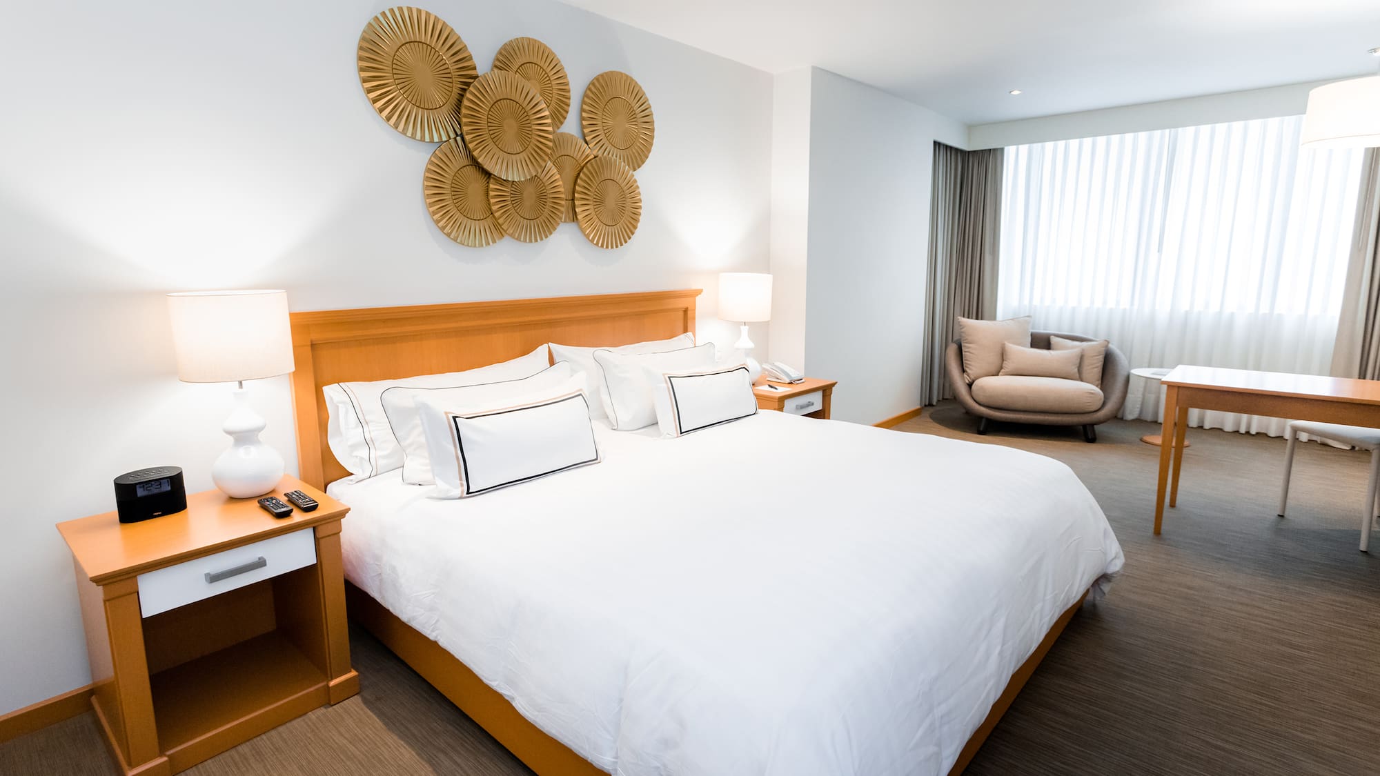 a bedroom with a bed and a chair