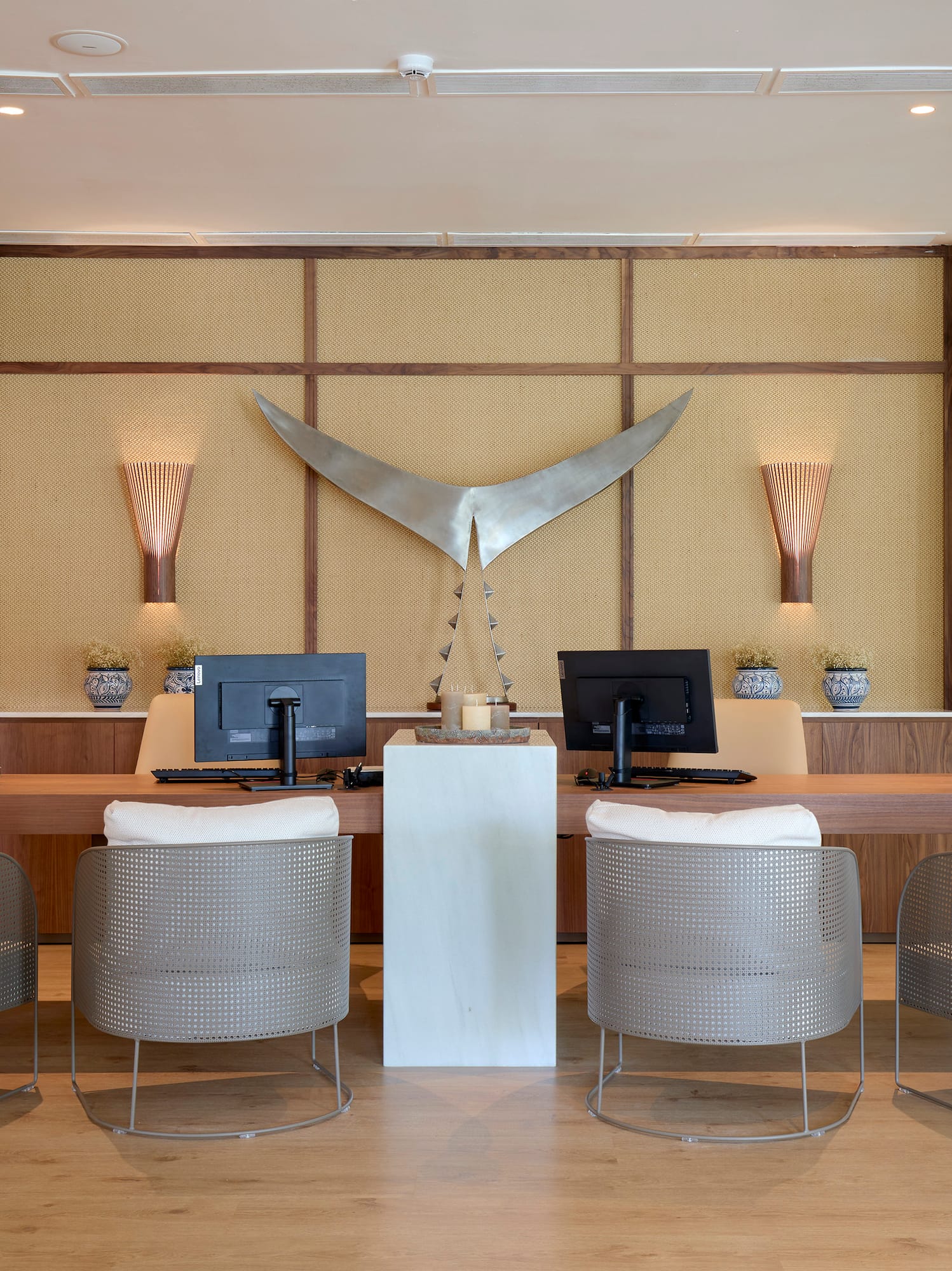 a room with a desk and chairs