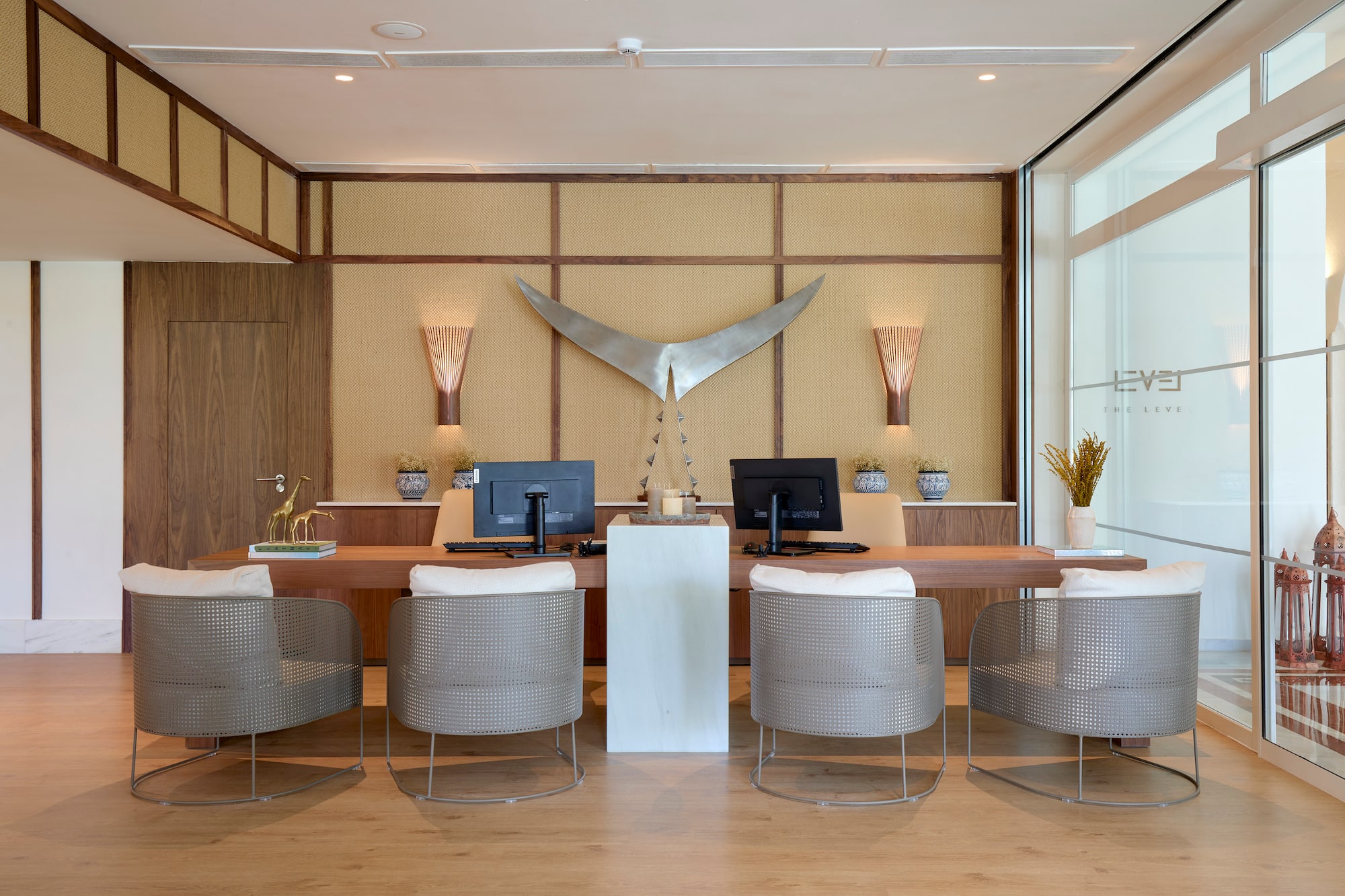 a room with a desk and chairs