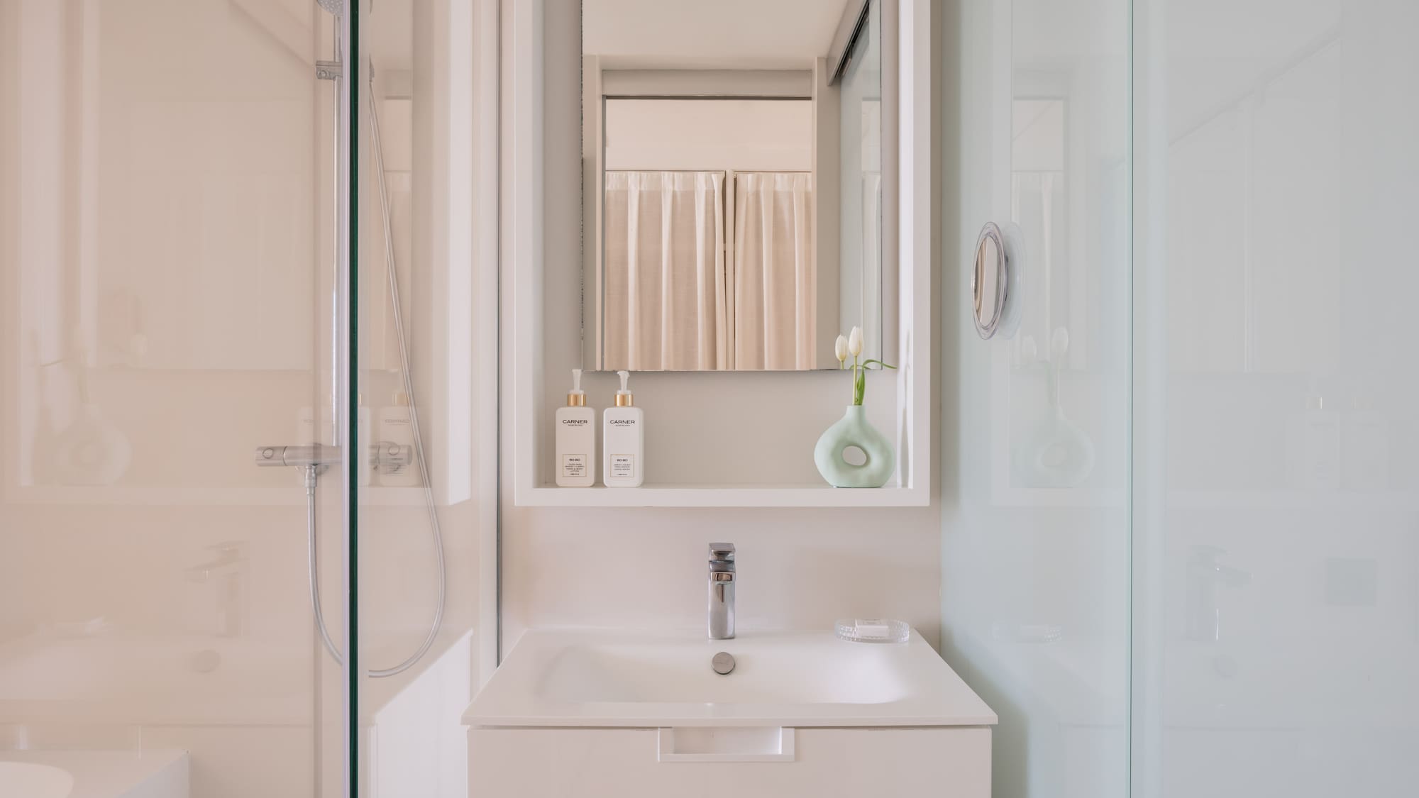 a bathroom with a mirror and a sink