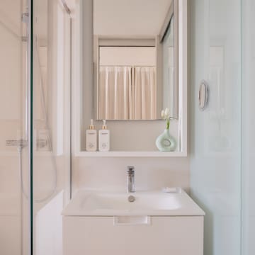 a bathroom with a mirror and a sink