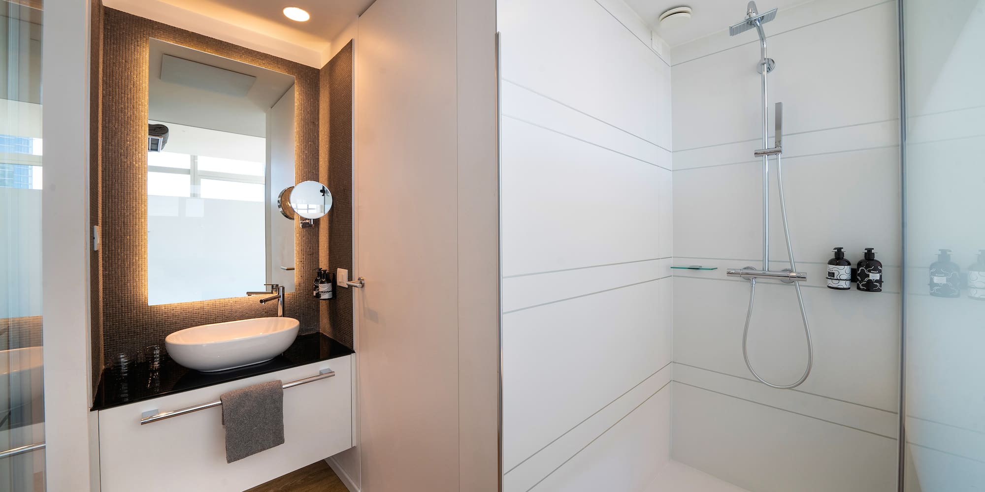 a bathroom with a sink and shower