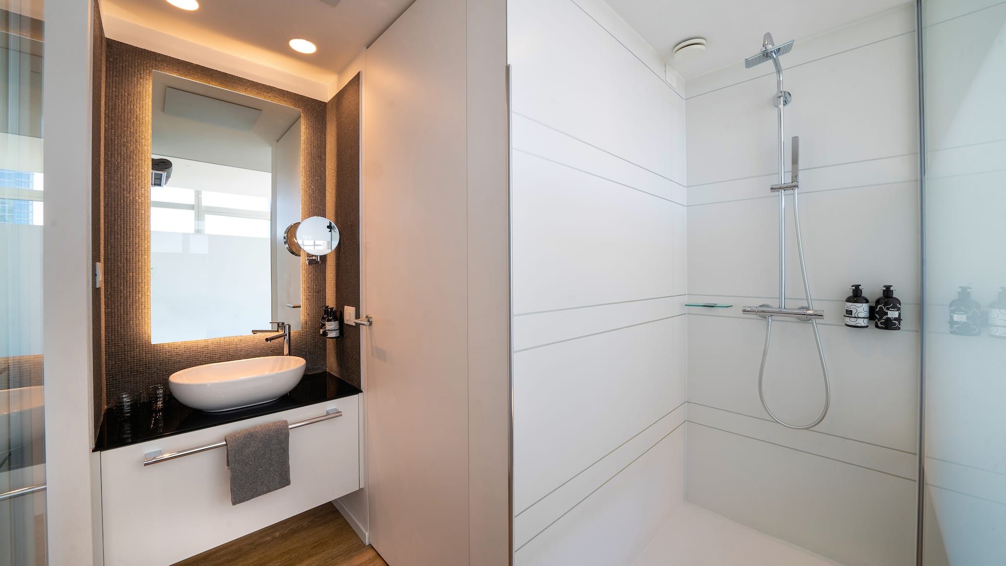 a bathroom with a sink and shower