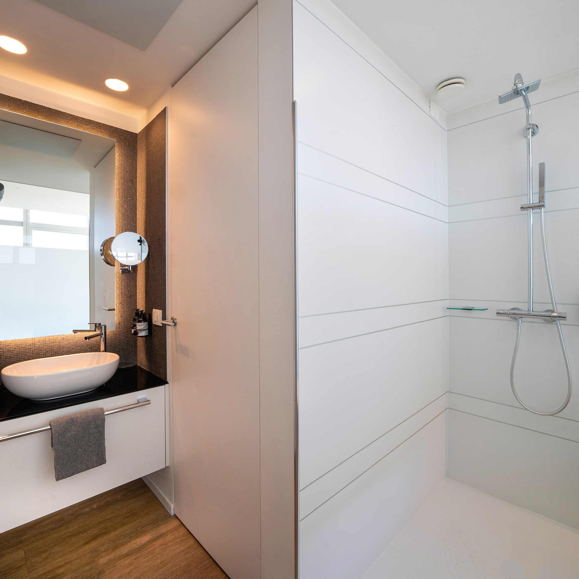 a bathroom with a sink and shower