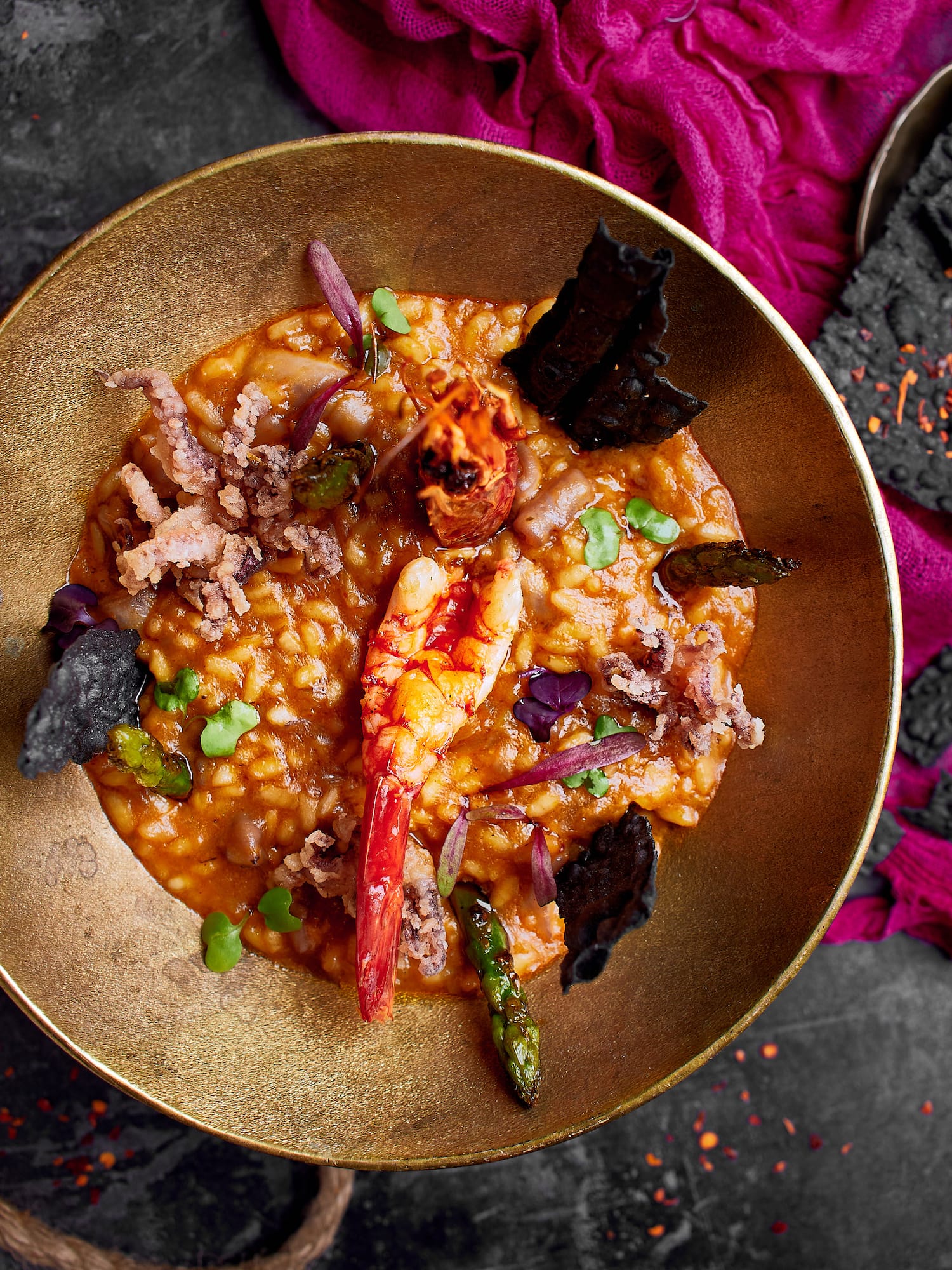 a bowl of food with shrimp and vegetables