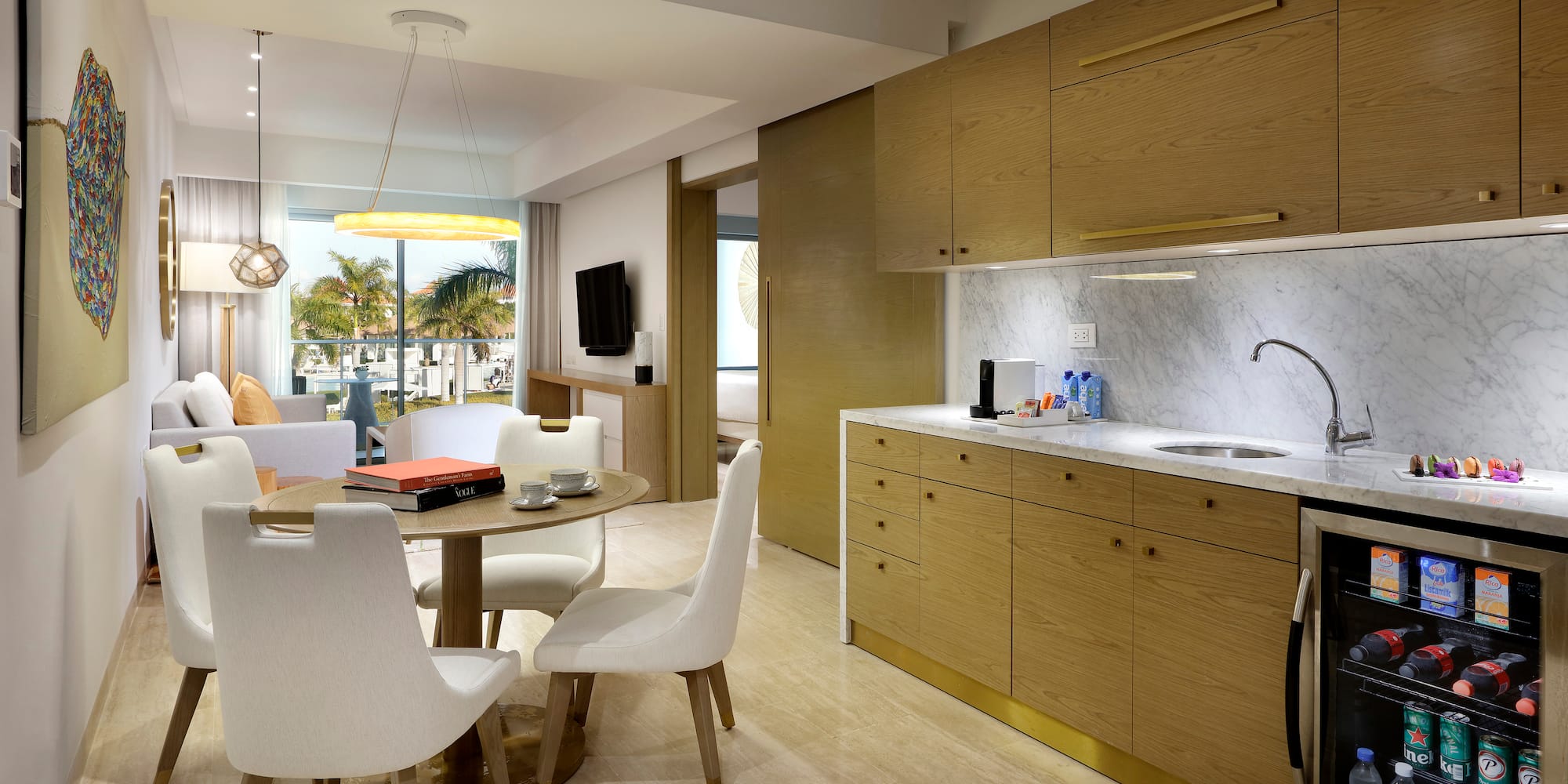 a kitchen and dining area with a table and chairs