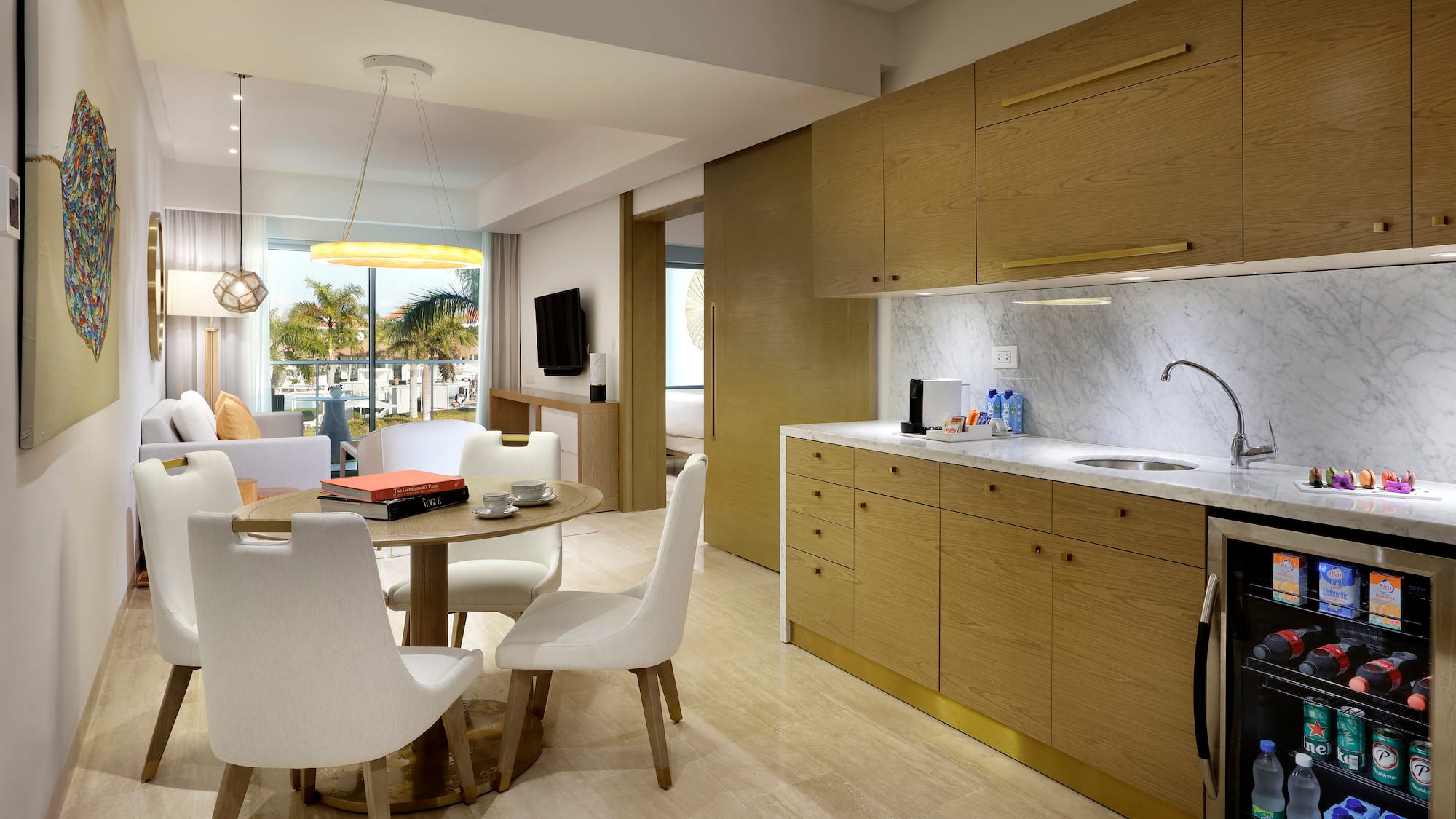 a kitchen and dining area with a table and chairs