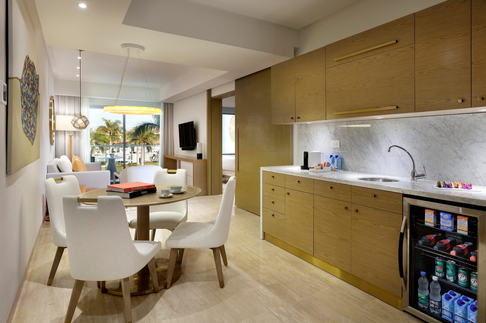 a kitchen and dining area with a table and chairs