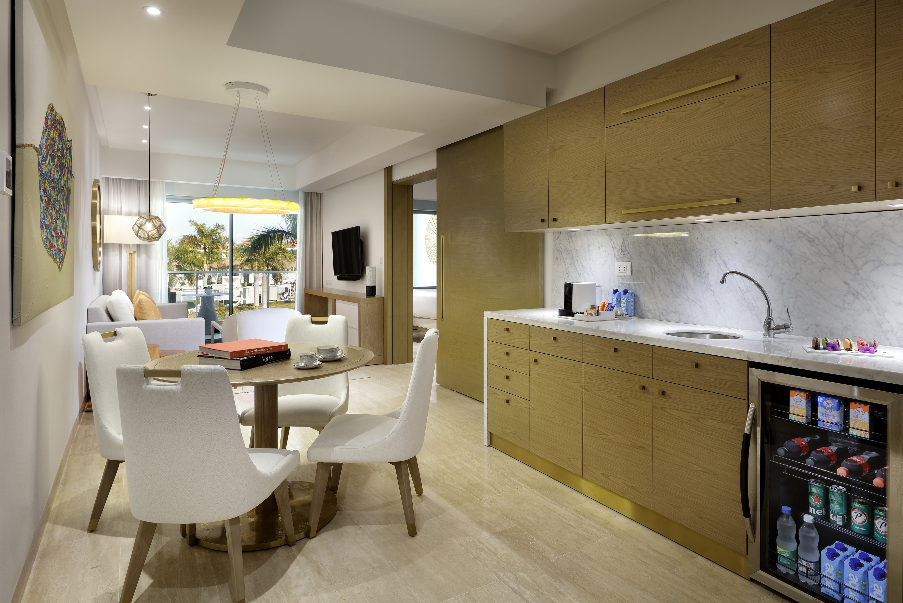 a kitchen and dining area with a table and chairs
