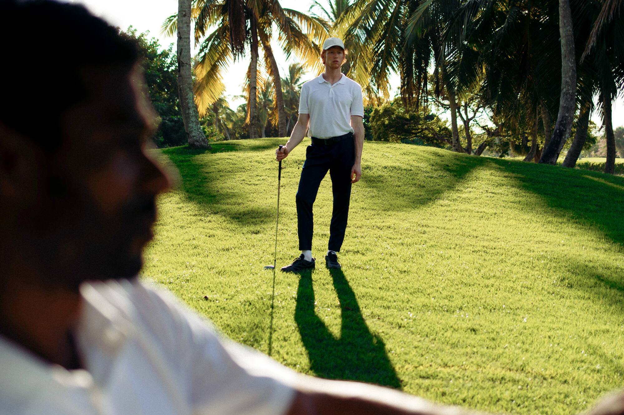 a man holding a golf club