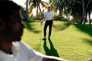 a man holding a golf club