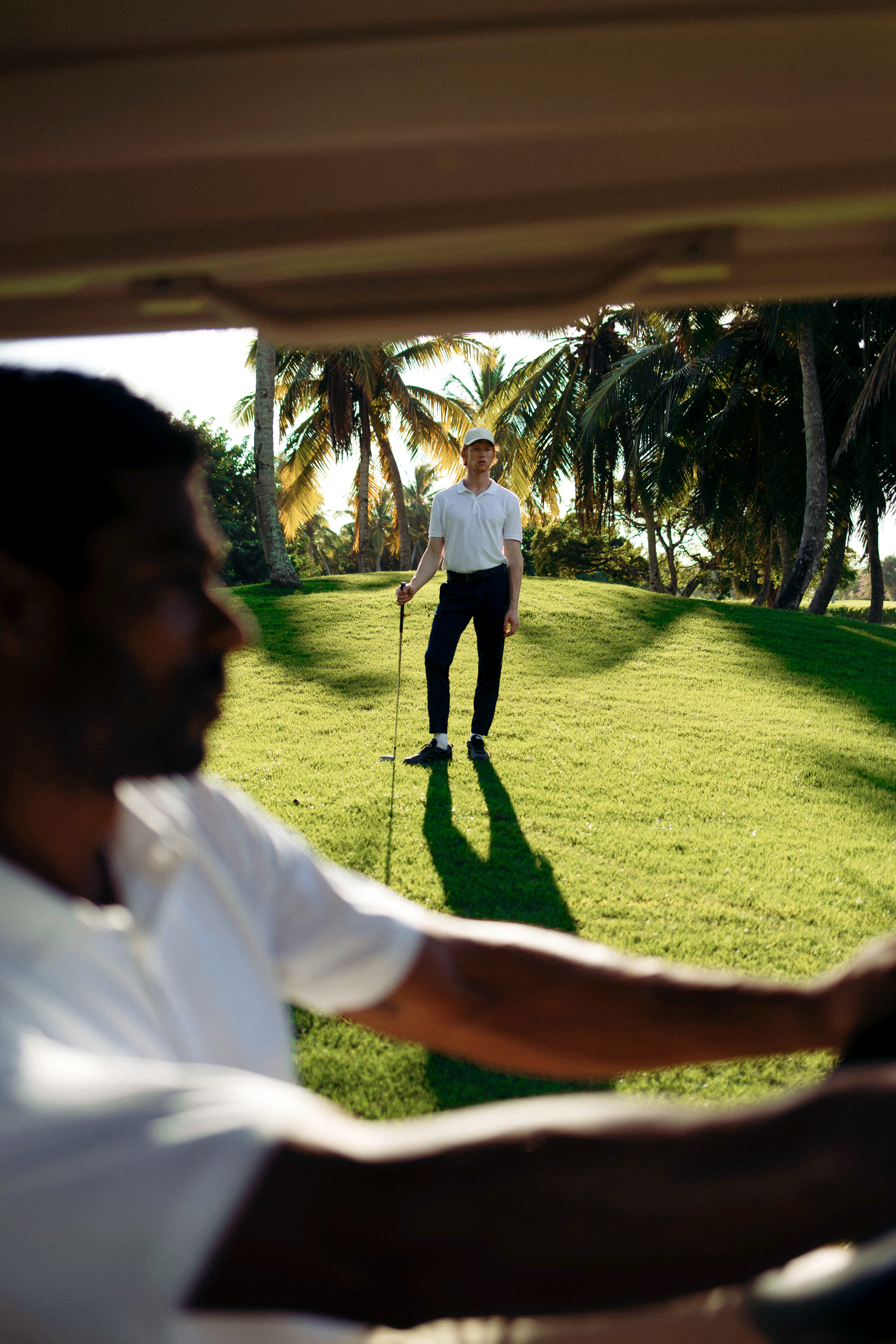 a man holding a golf club