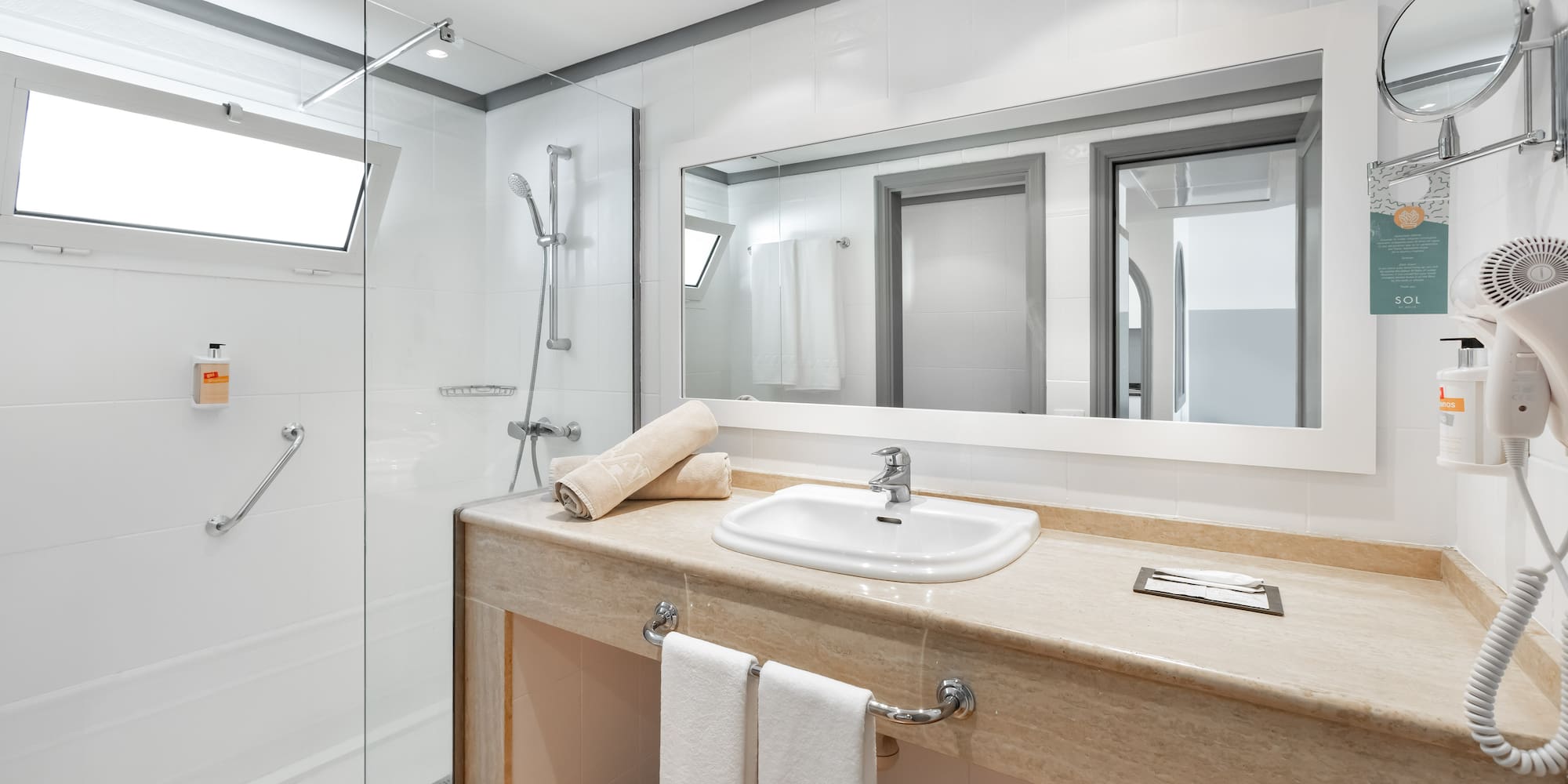 a bathroom with a sink and shower