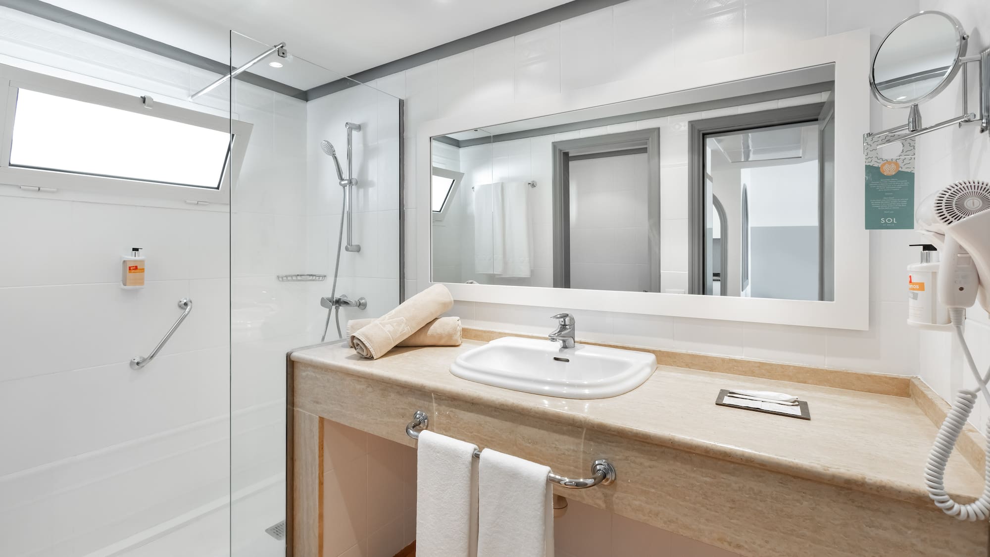 a bathroom with a sink and shower