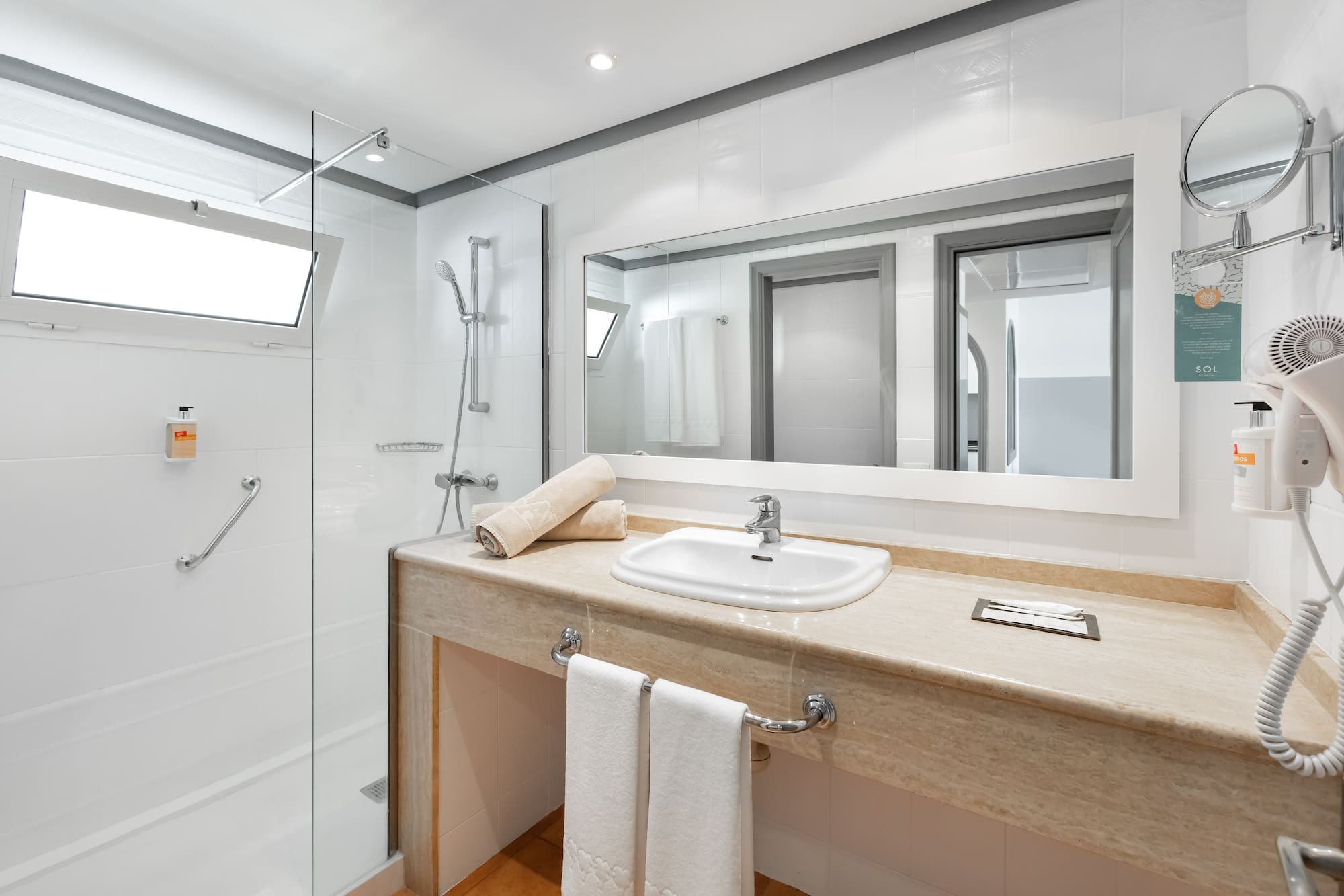 a bathroom with a sink and shower