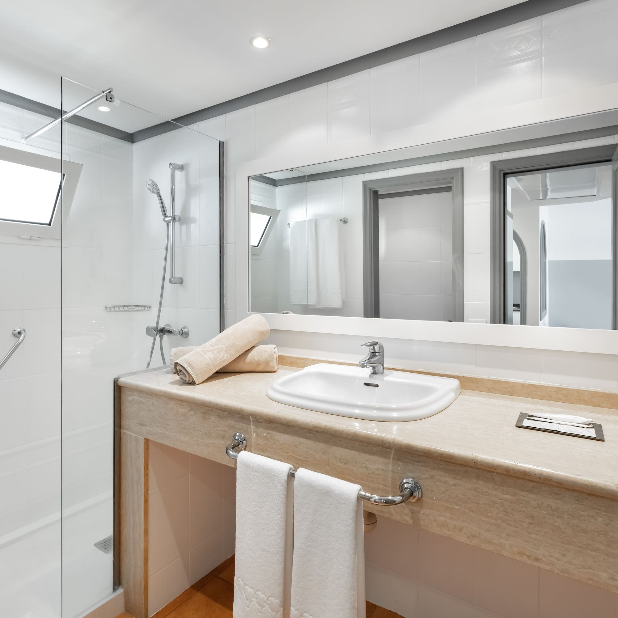 a bathroom with a sink and shower