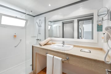 a bathroom with a sink and shower